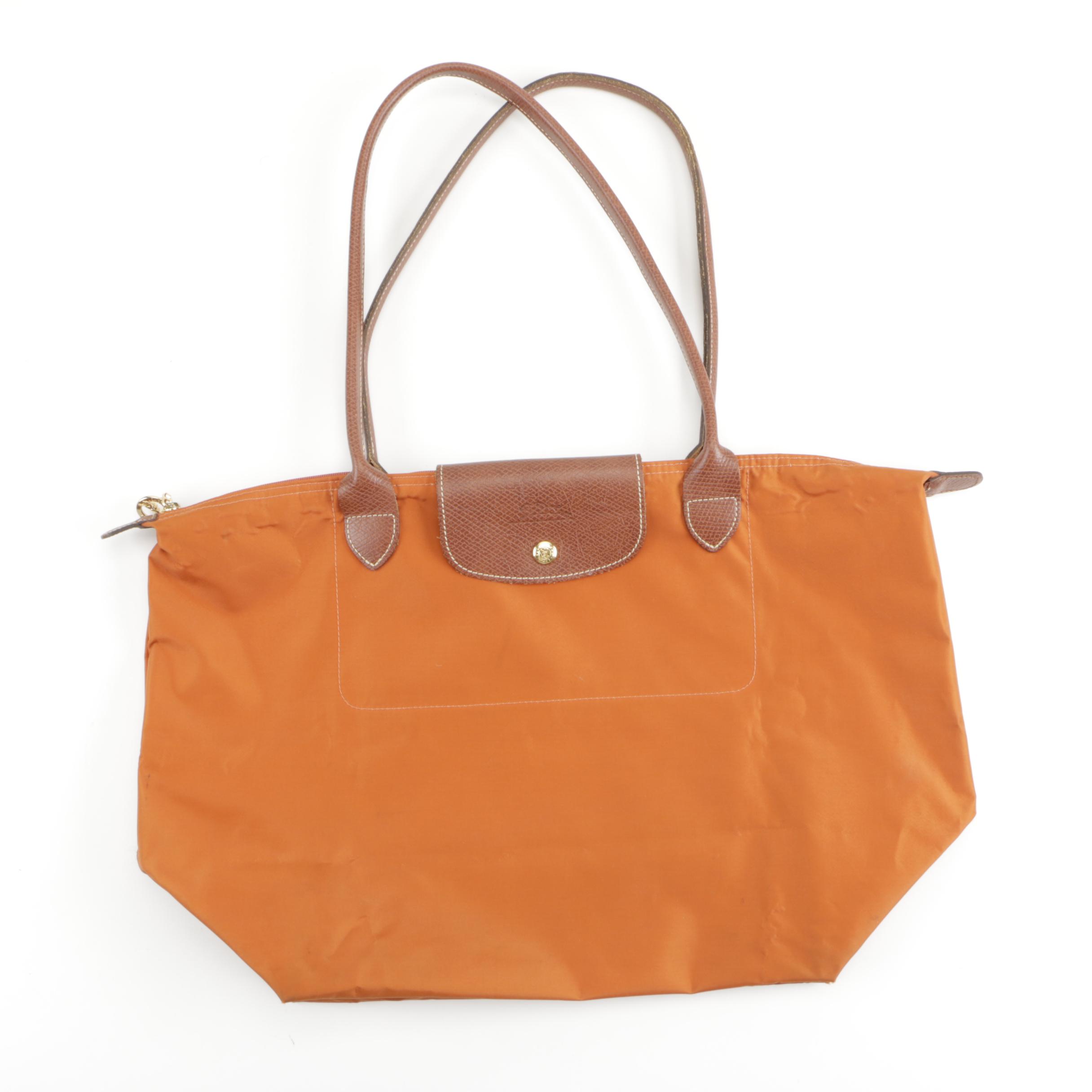 Orange Longchamp Tote and Kate Spade Wristlet