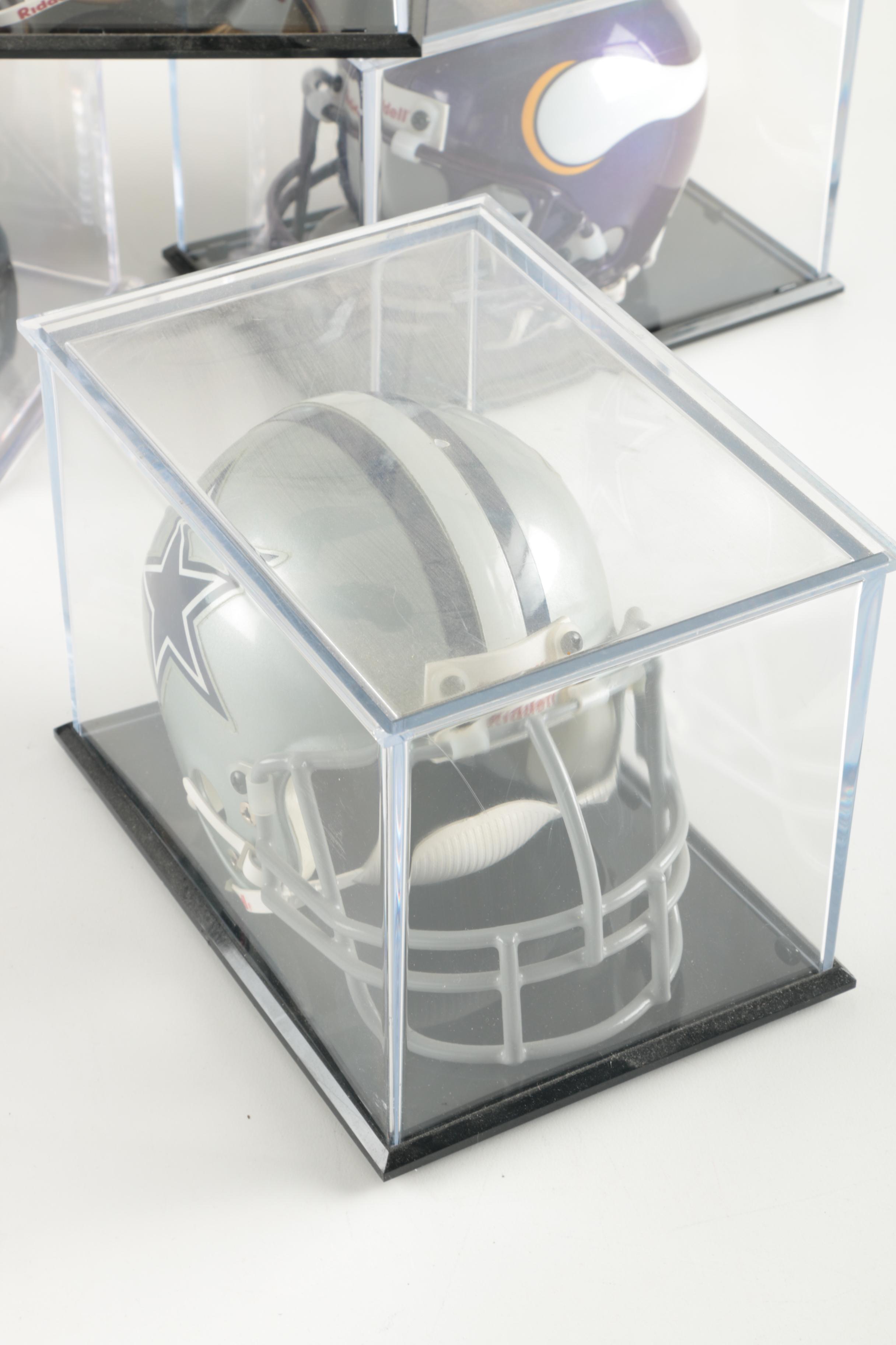 Four Miniature Football Helmets in Cases