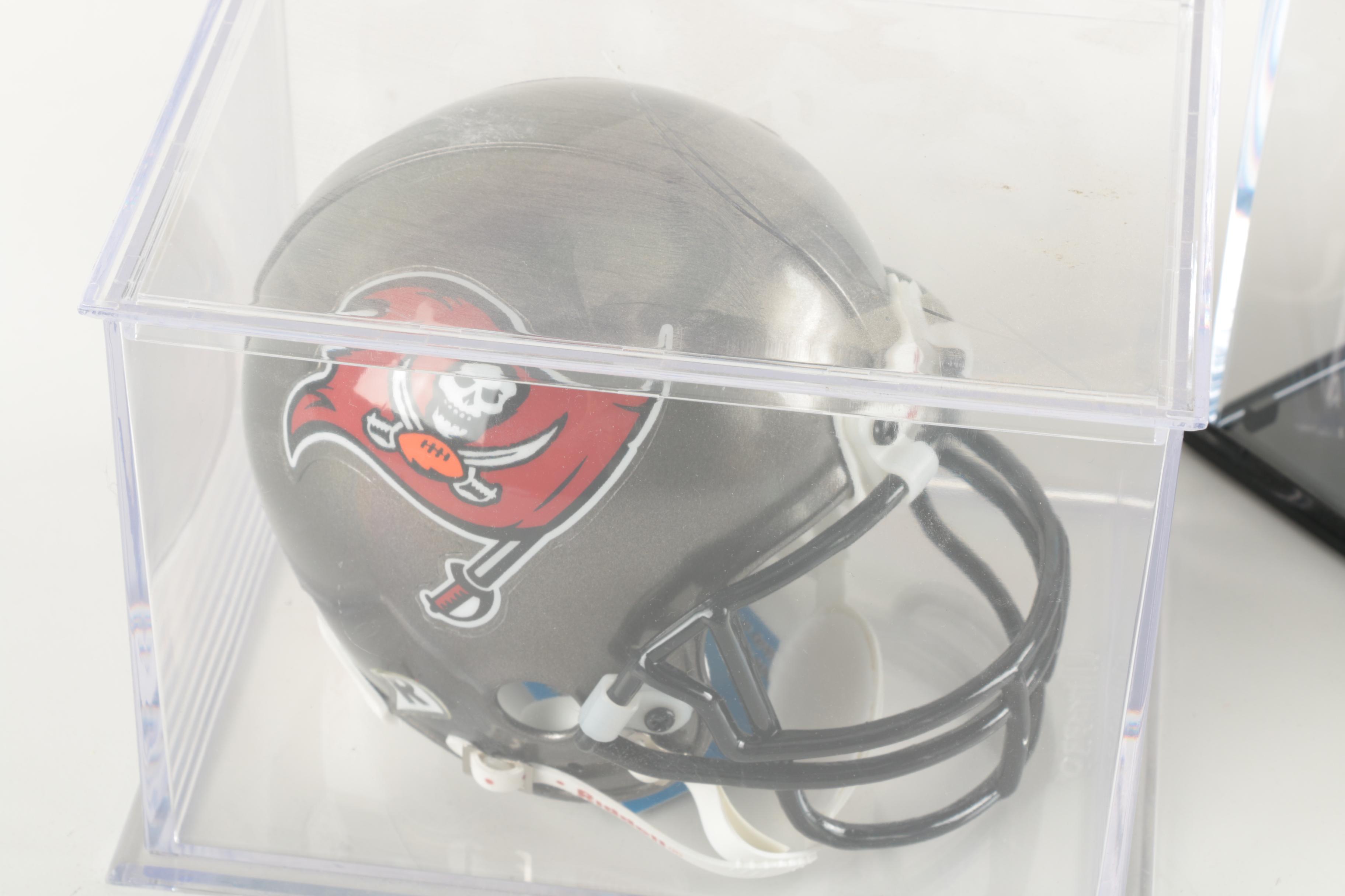 Four Miniature Football Helmets in Cases