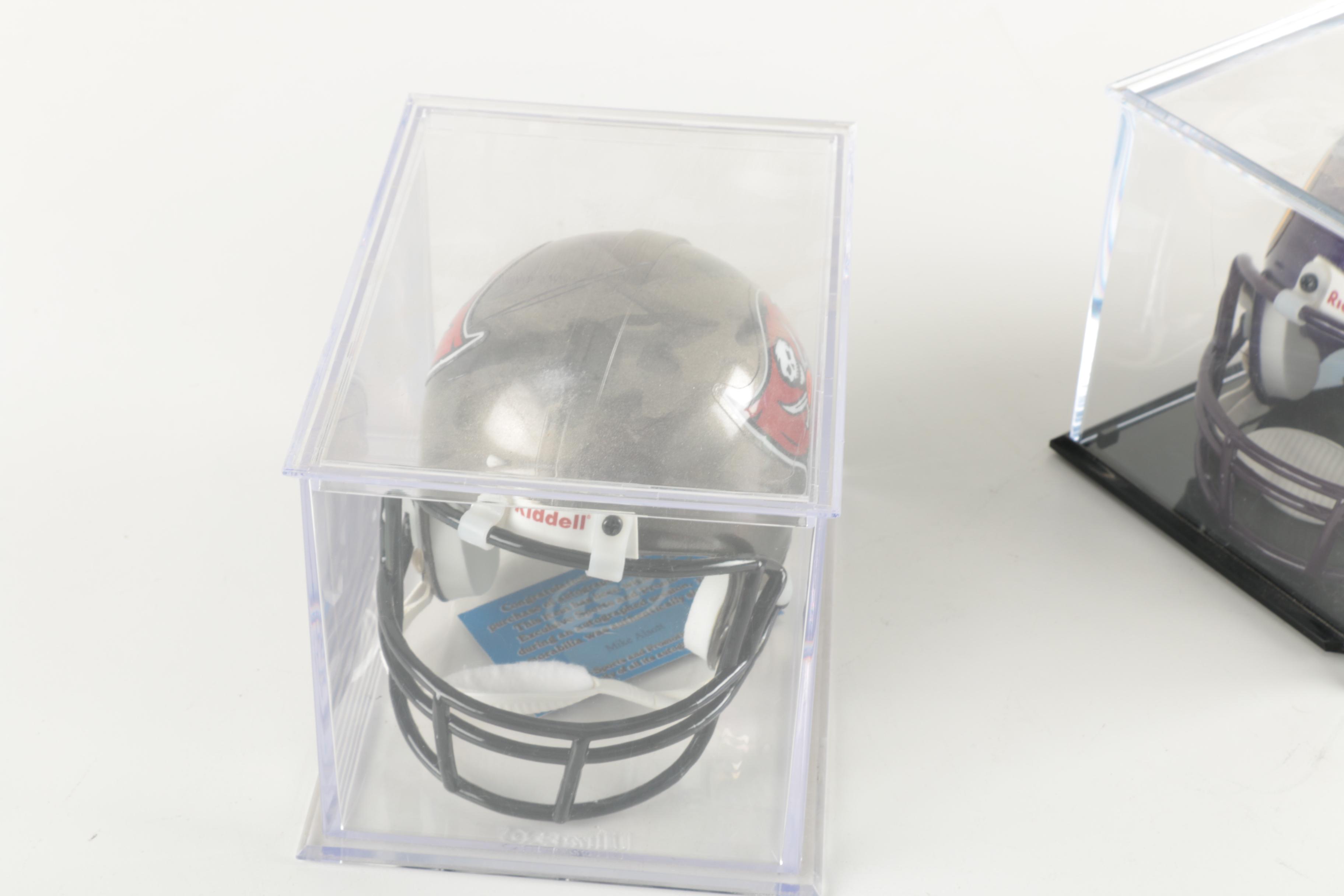 Four Miniature Football Helmets in Cases
