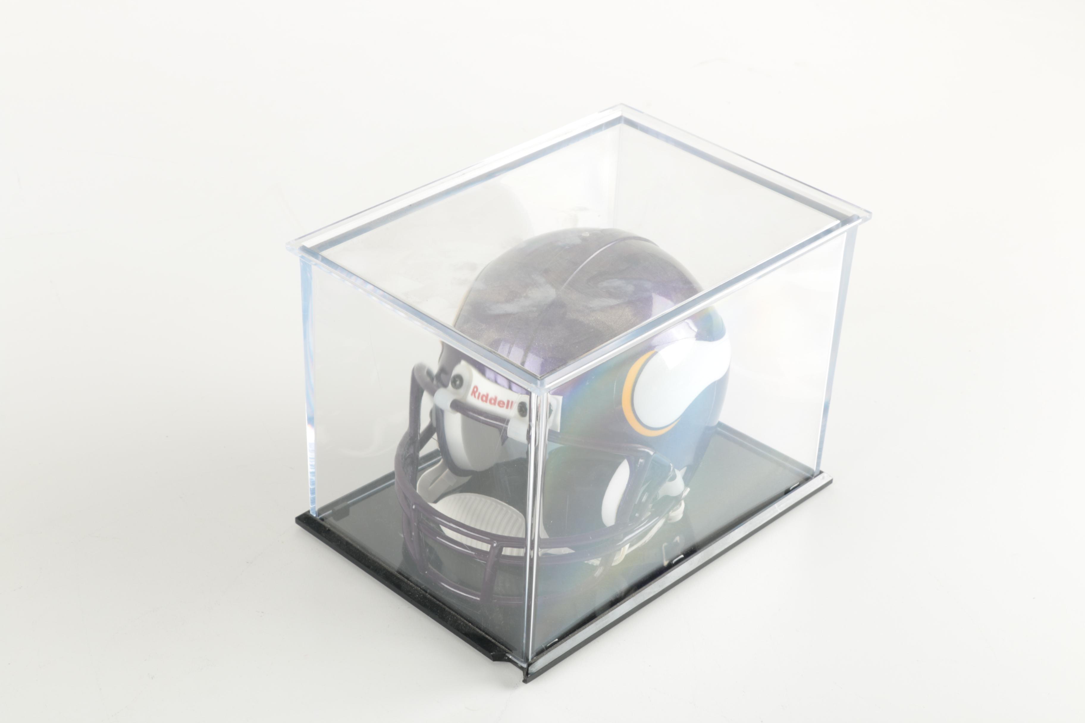 Four Miniature Football Helmets in Cases