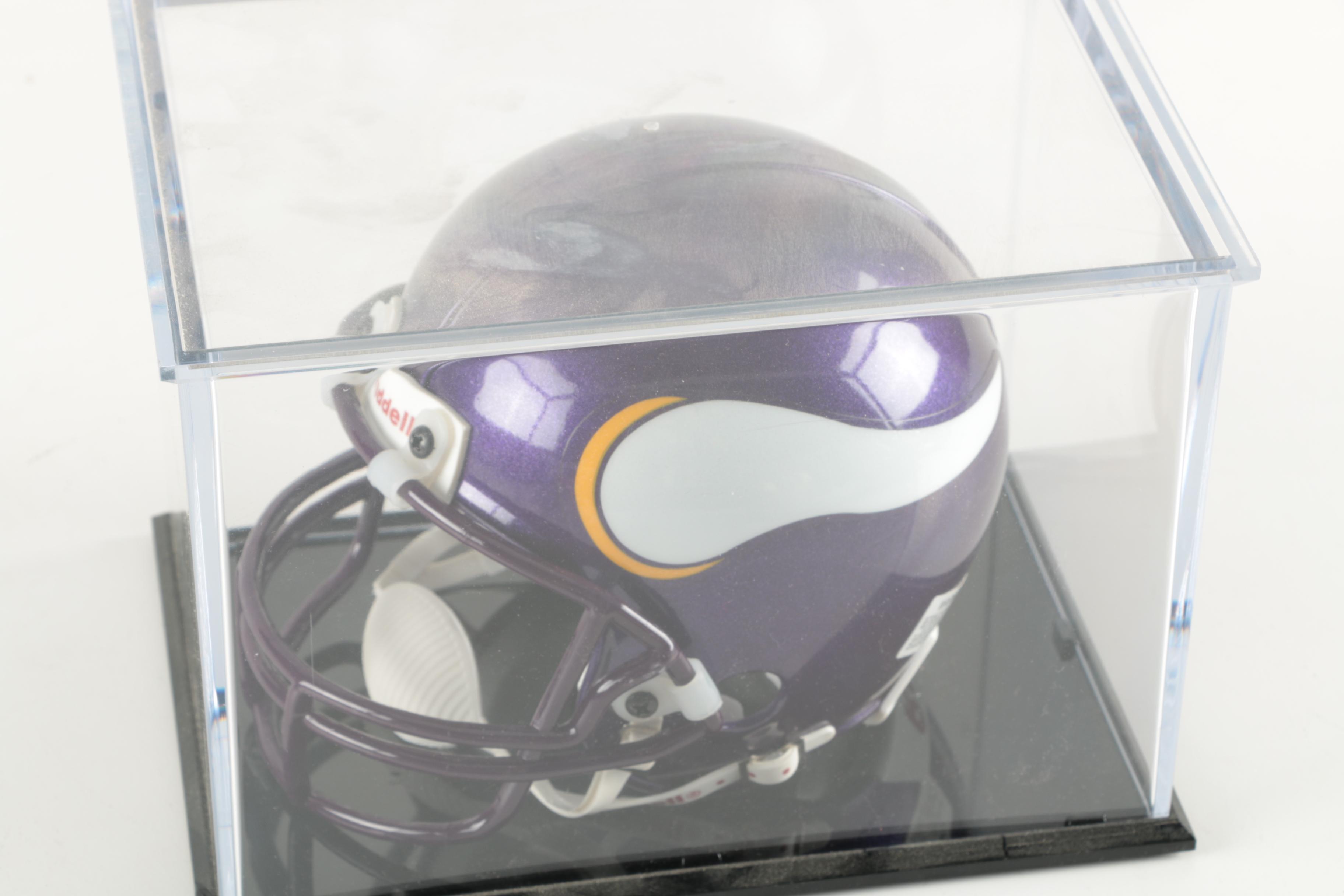 Four Miniature Football Helmets in Cases