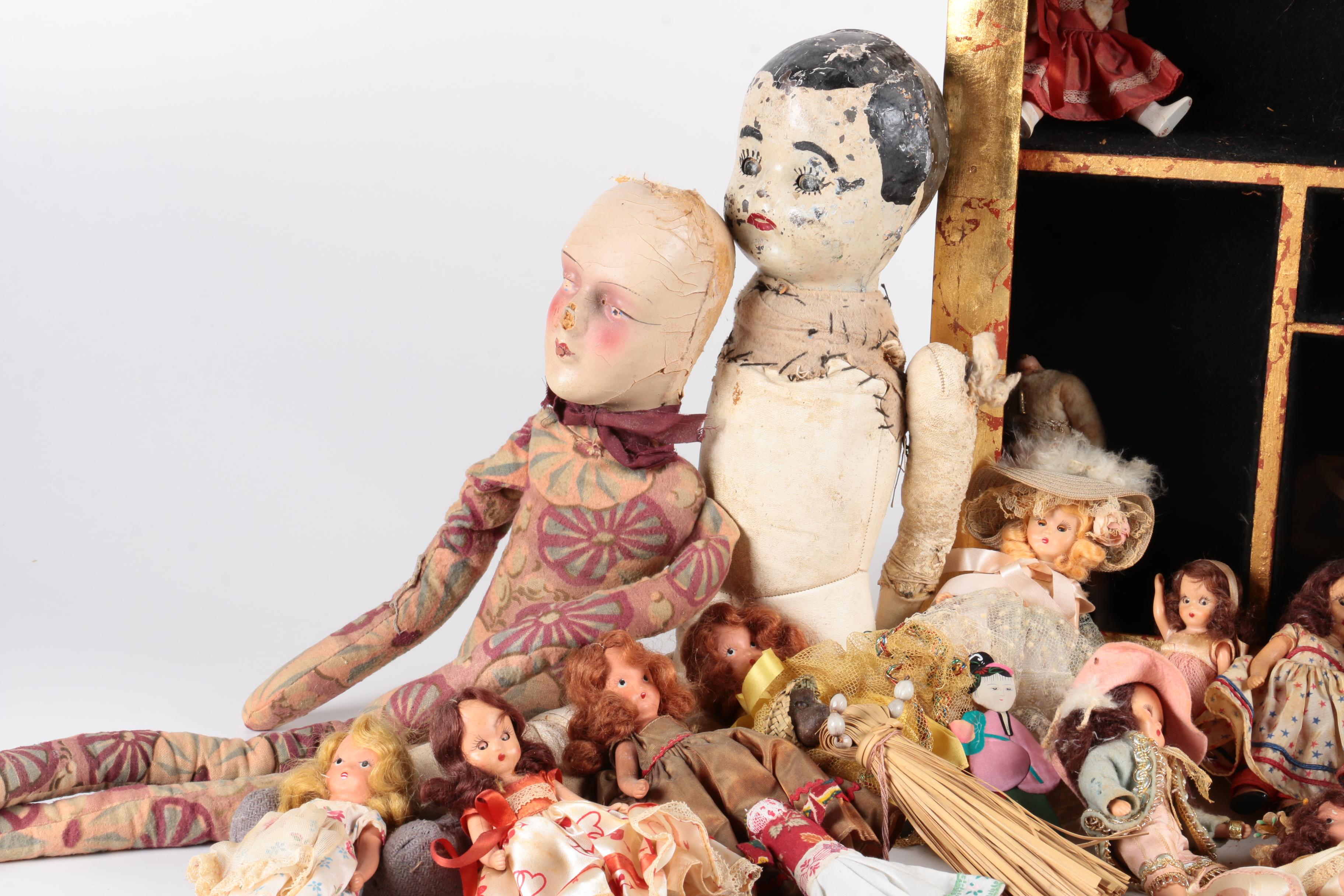 Variety of Dolls and Wooden Cabinet