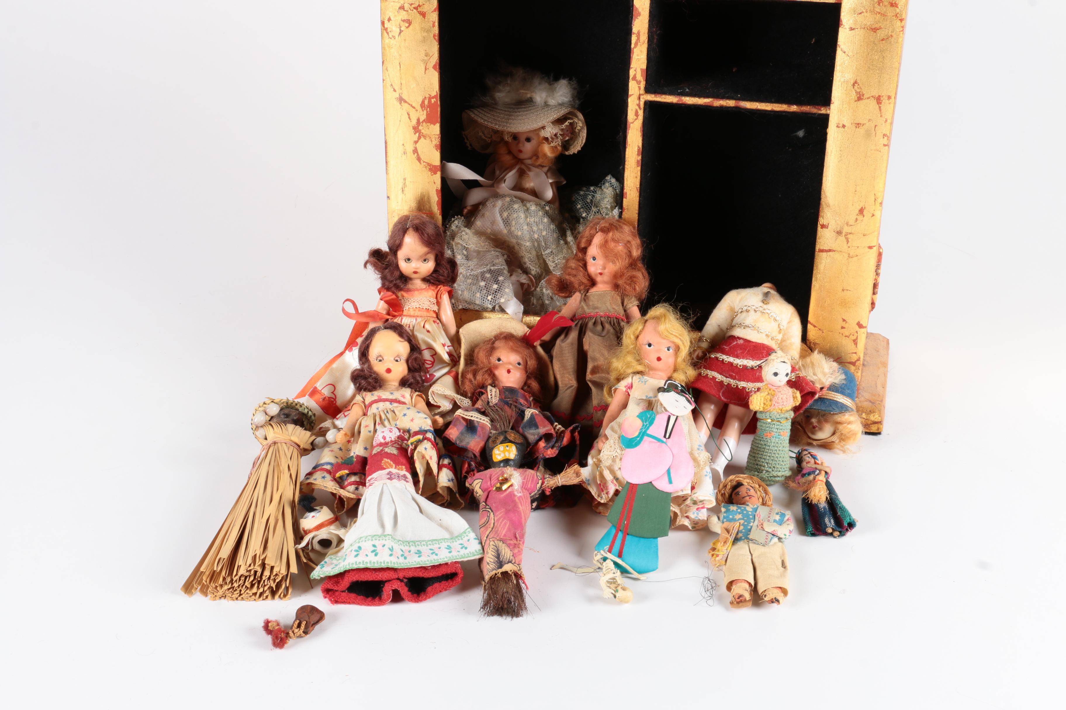 Variety of Dolls and Wooden Cabinet