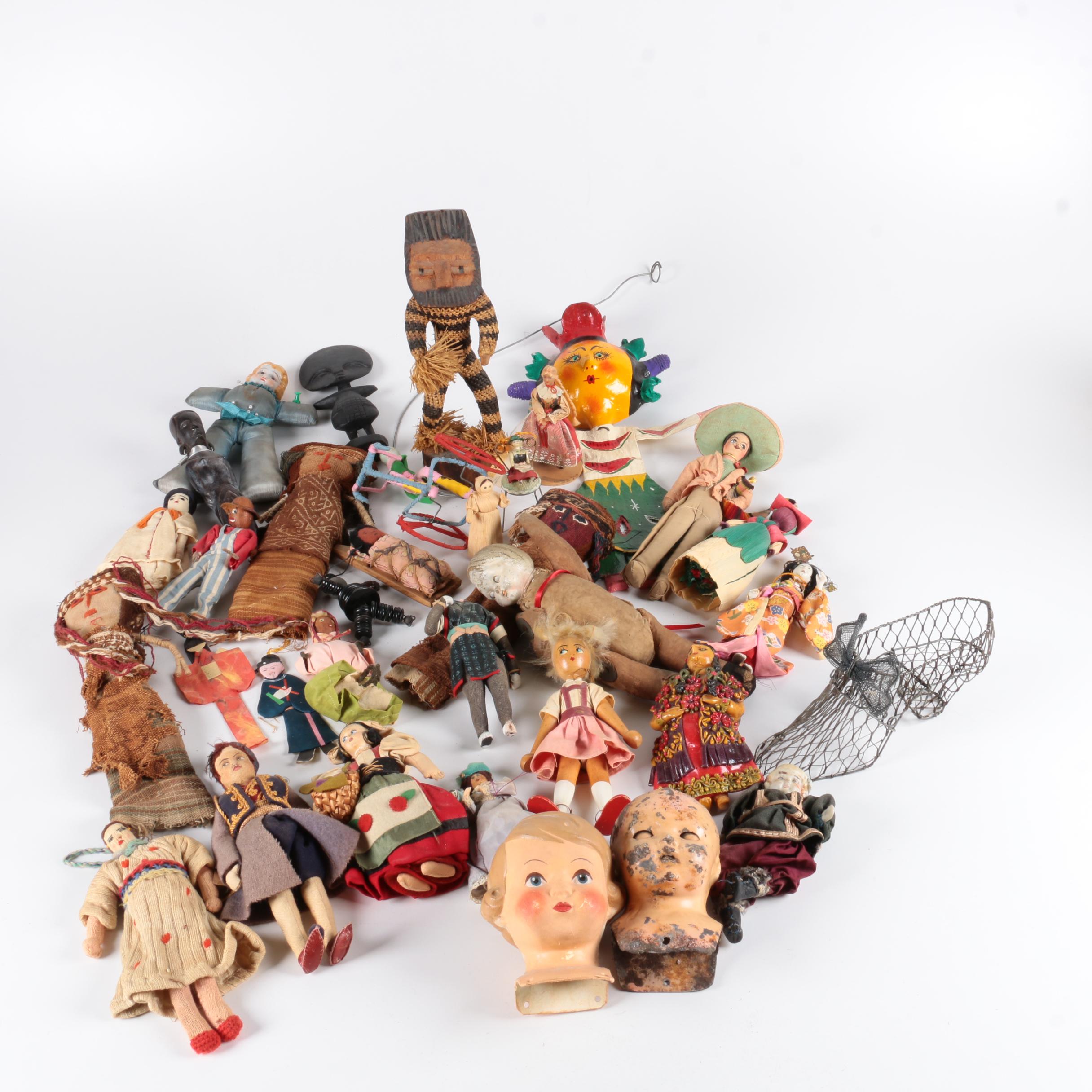 Variety of Dolls and Wooden Cabinet