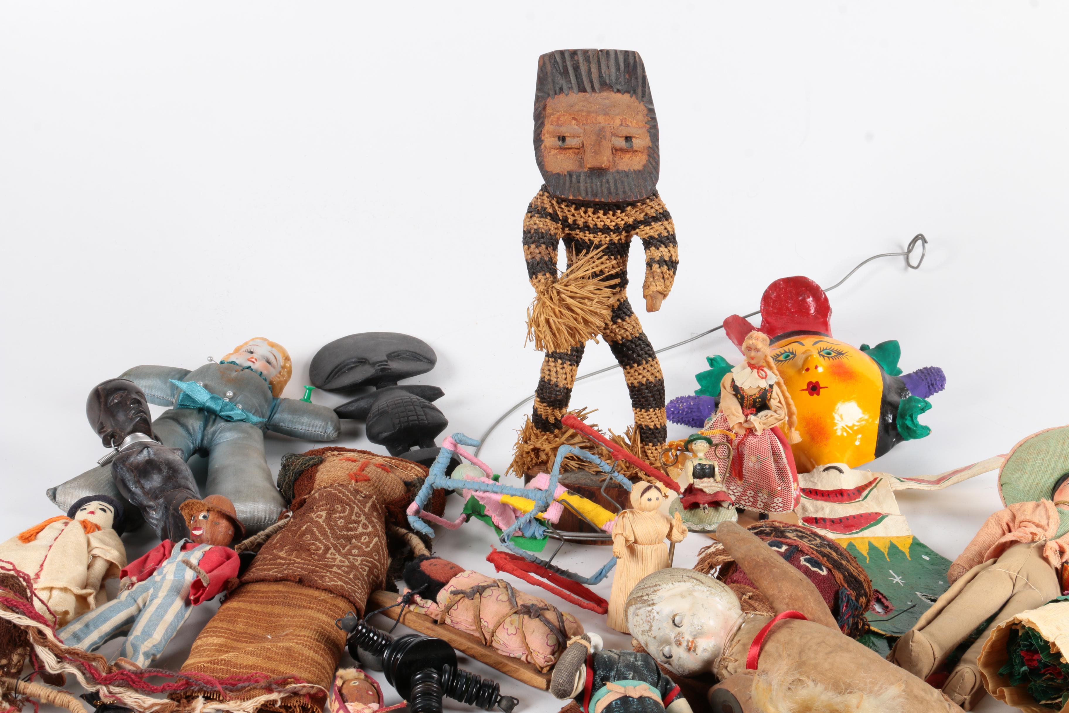 Variety of Dolls and Wooden Cabinet