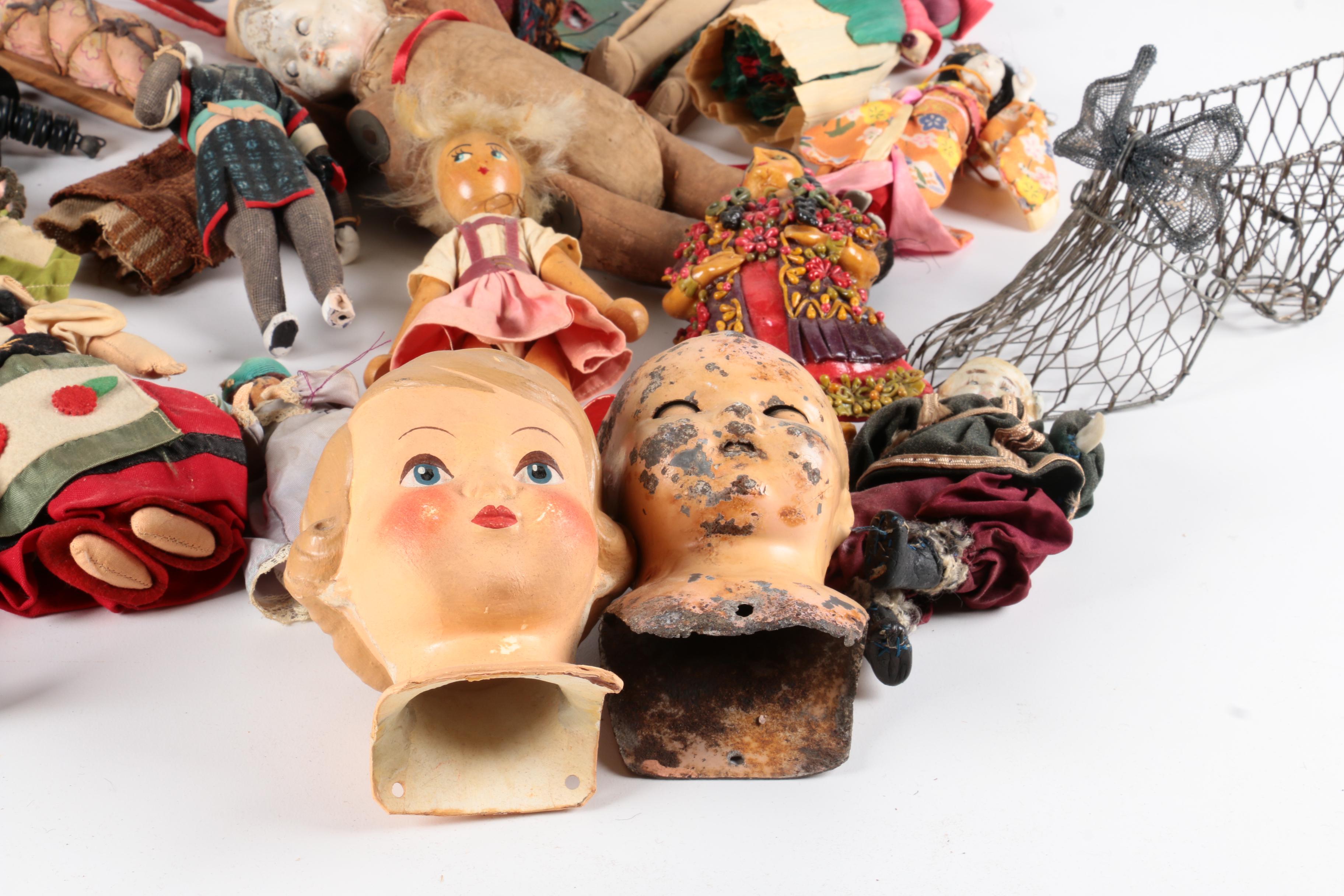 Variety of Dolls and Wooden Cabinet