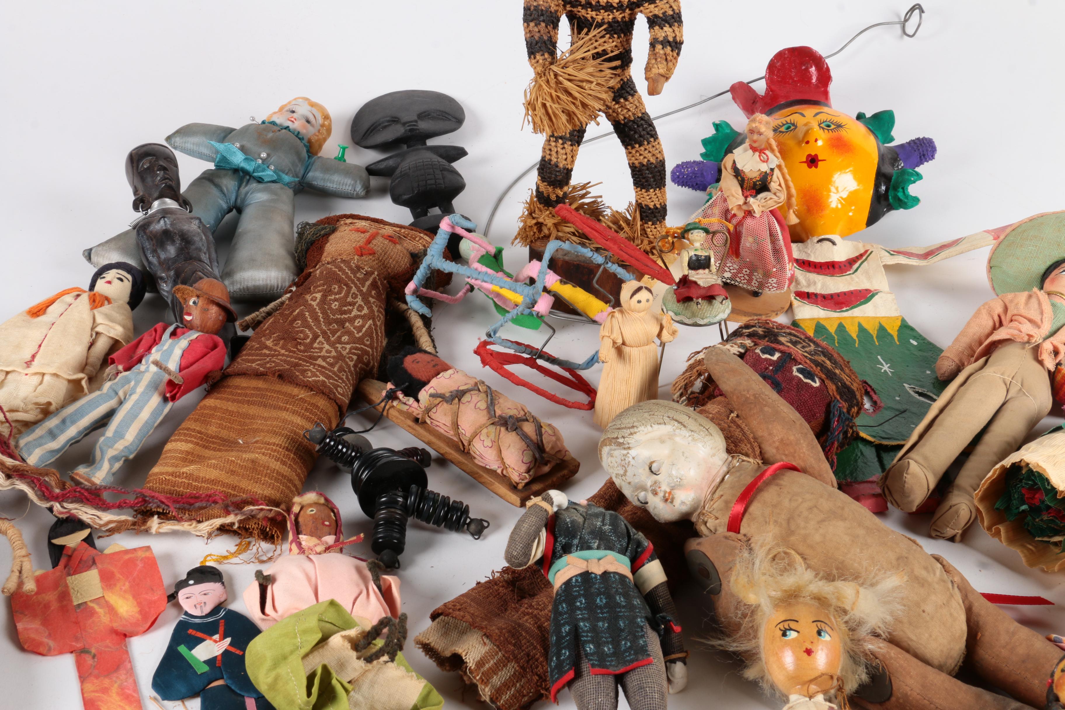 Variety of Dolls and Wooden Cabinet