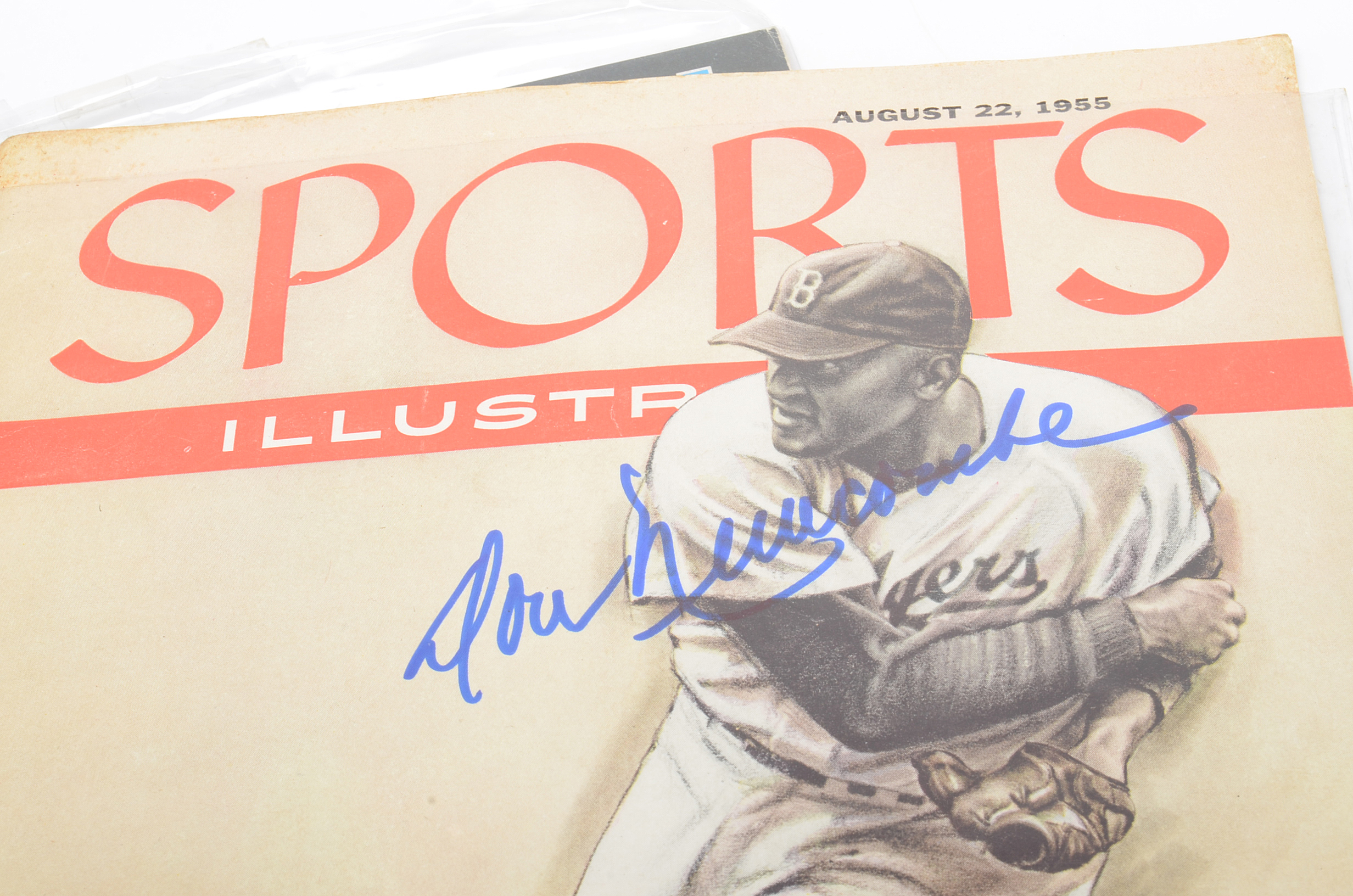 Seven Signed Sports Magazines