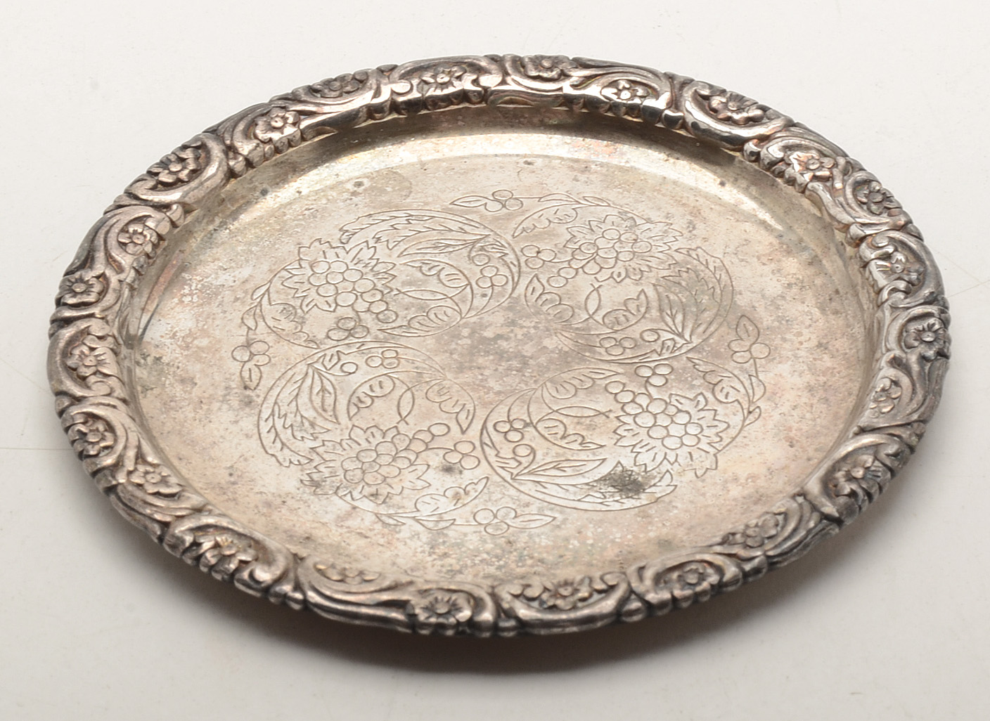 Set of Four Silverplated Coasters with a Brandy Decanter Tag