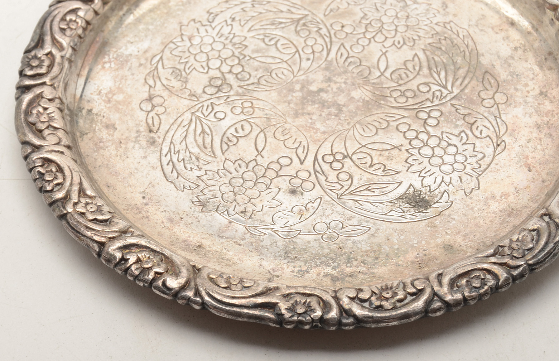 Set of Four Silverplated Coasters with a Brandy Decanter Tag