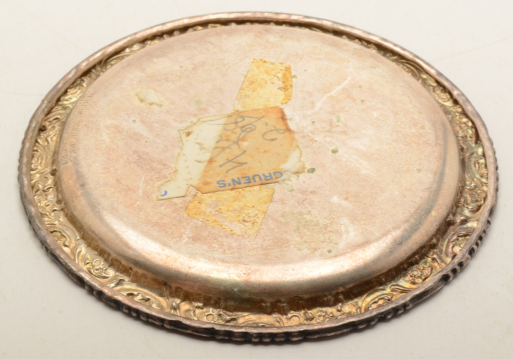 Set of Four Silverplated Coasters with a Brandy Decanter Tag