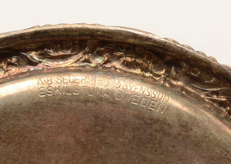 Set of Four Silverplated Coasters with a Brandy Decanter Tag