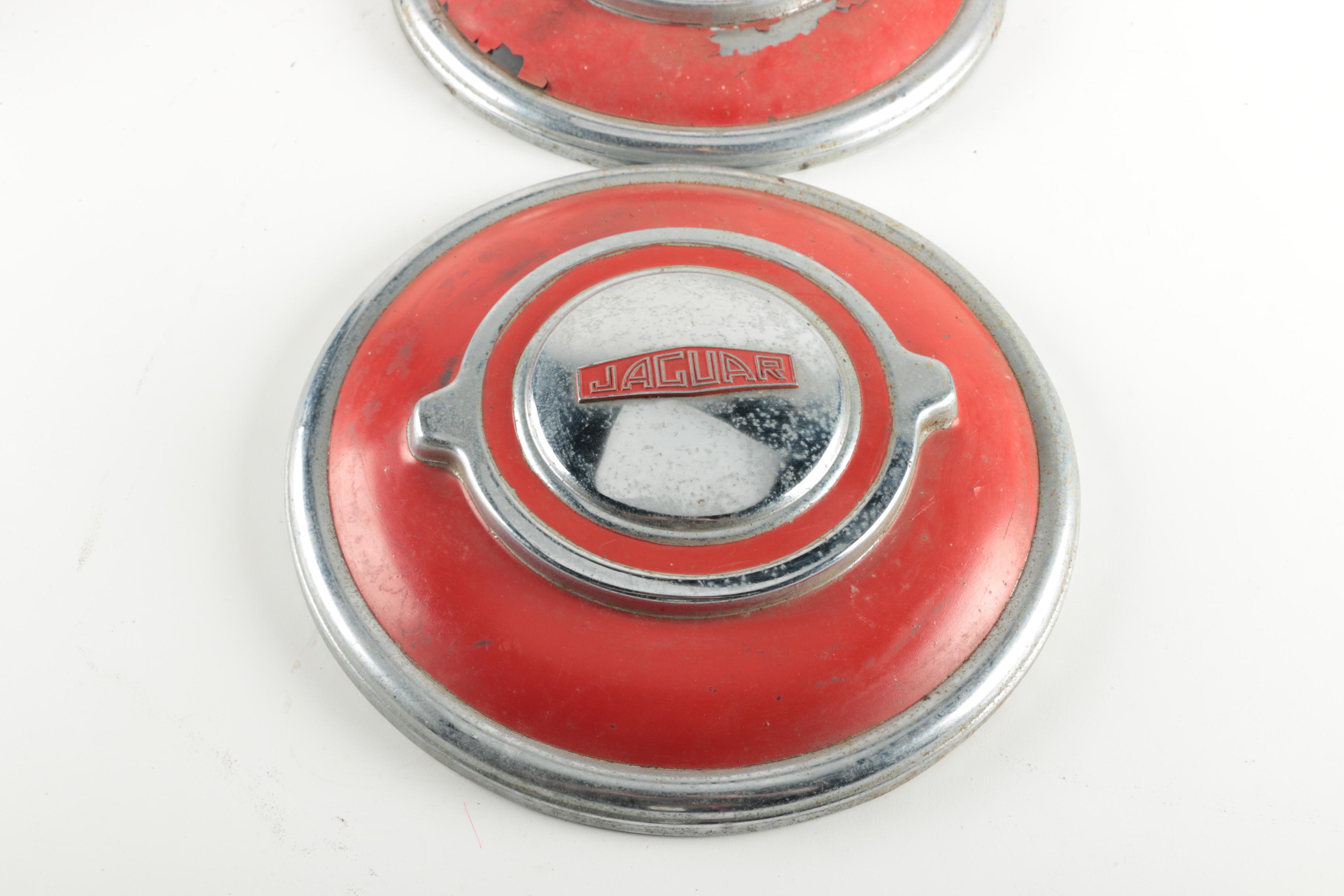 Two Red Vintage Jaguar Hubcaps