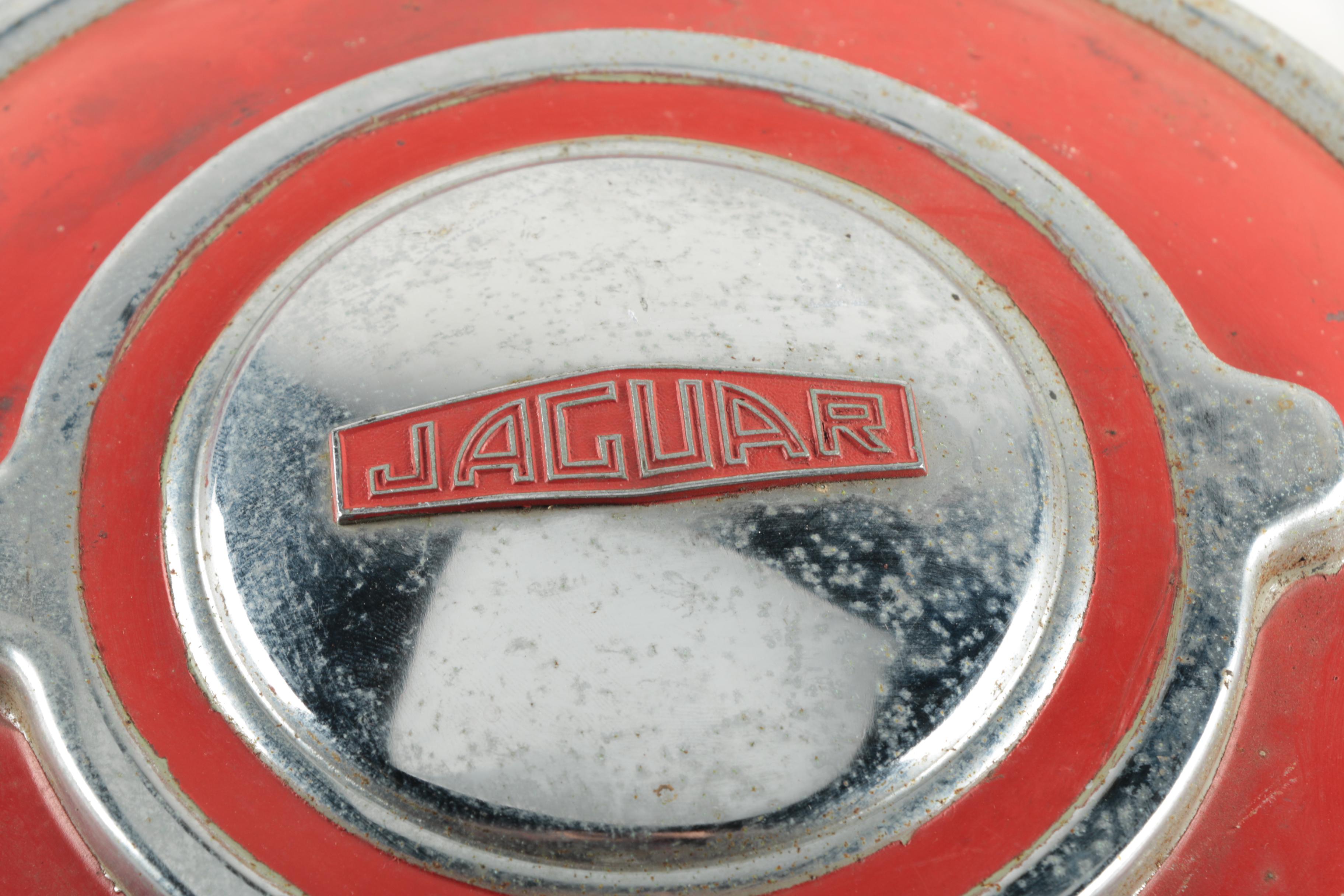 Two Red Vintage Jaguar Hubcaps