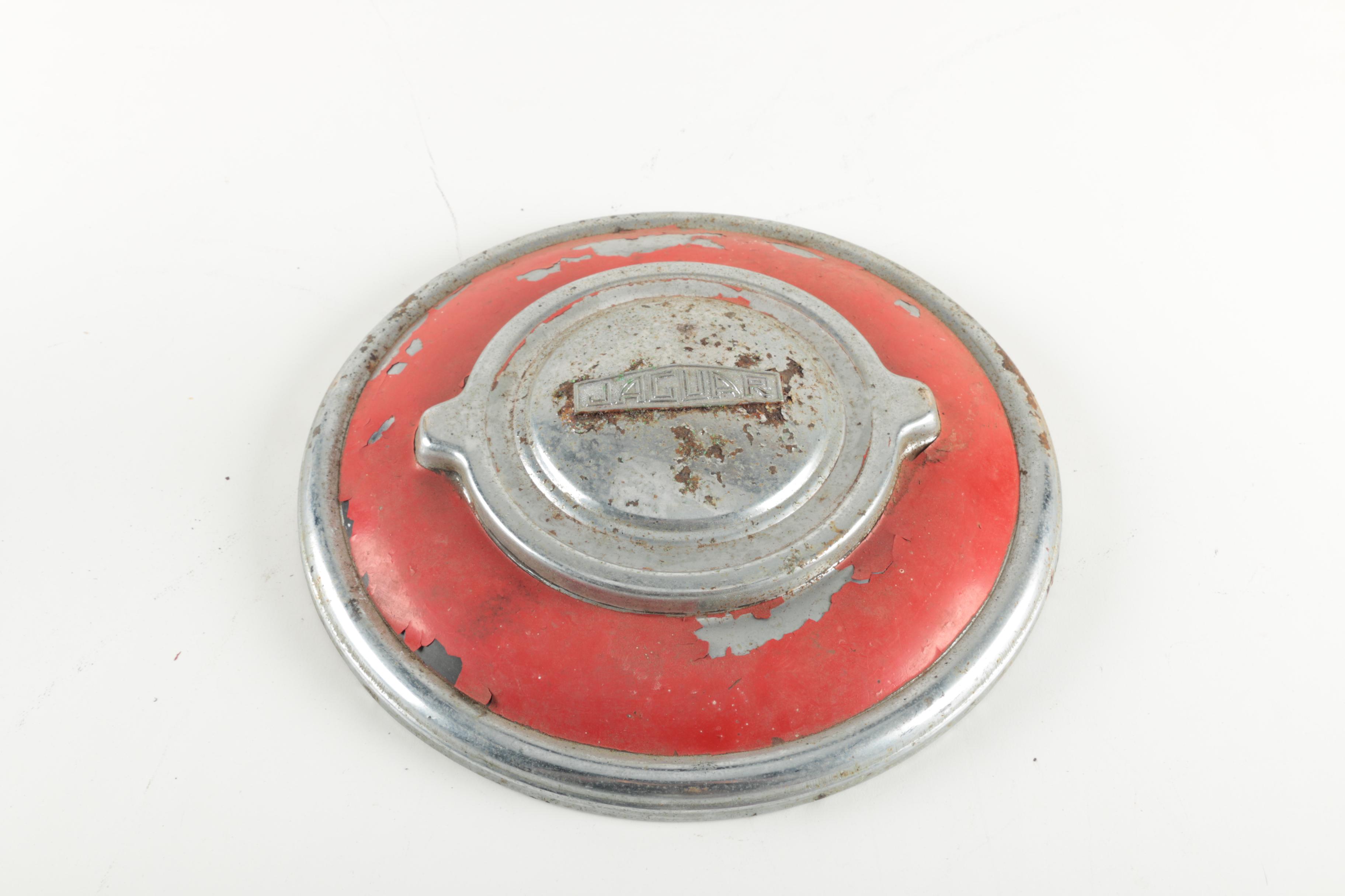 Two Red Vintage Jaguar Hubcaps
