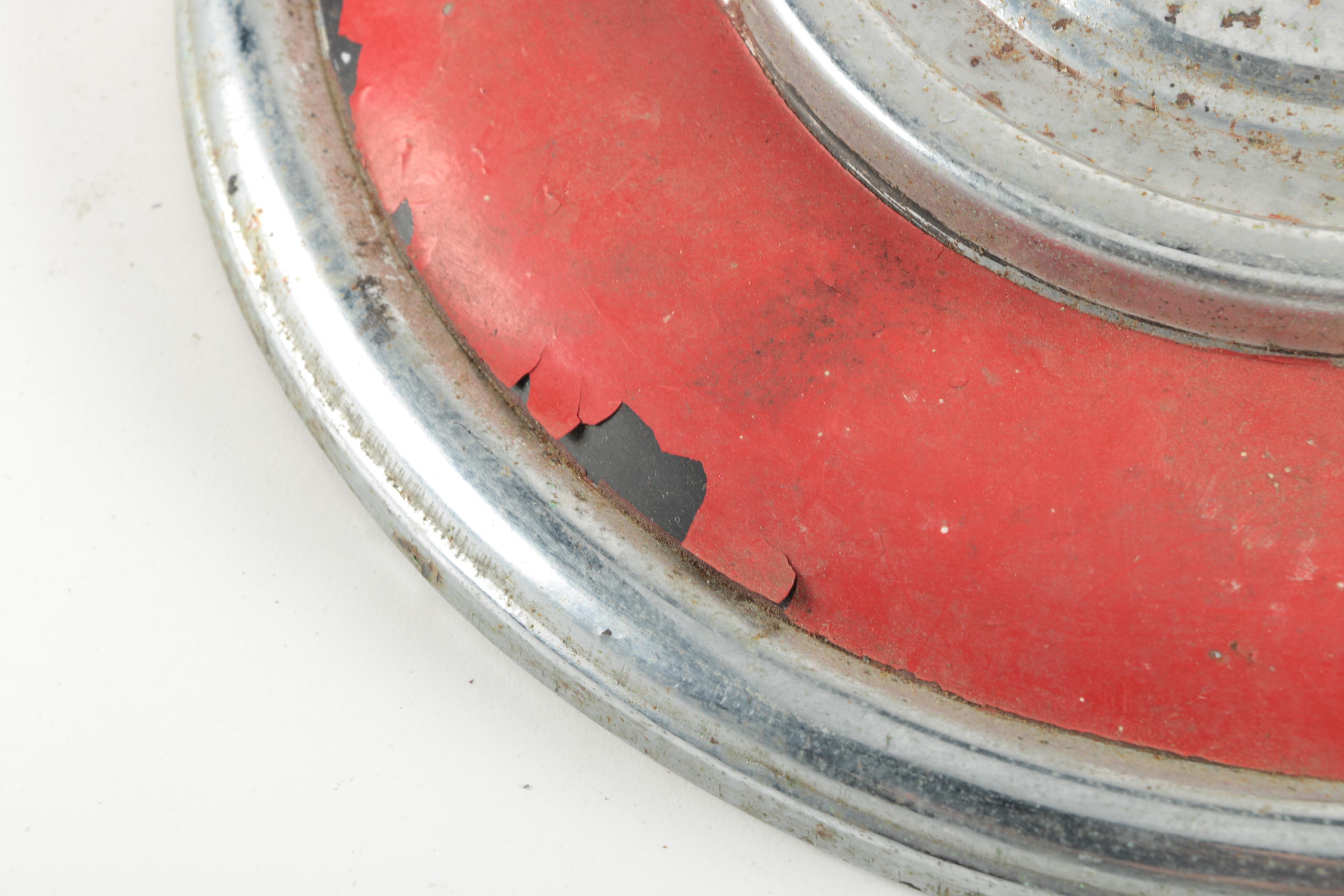 Two Red Vintage Jaguar Hubcaps