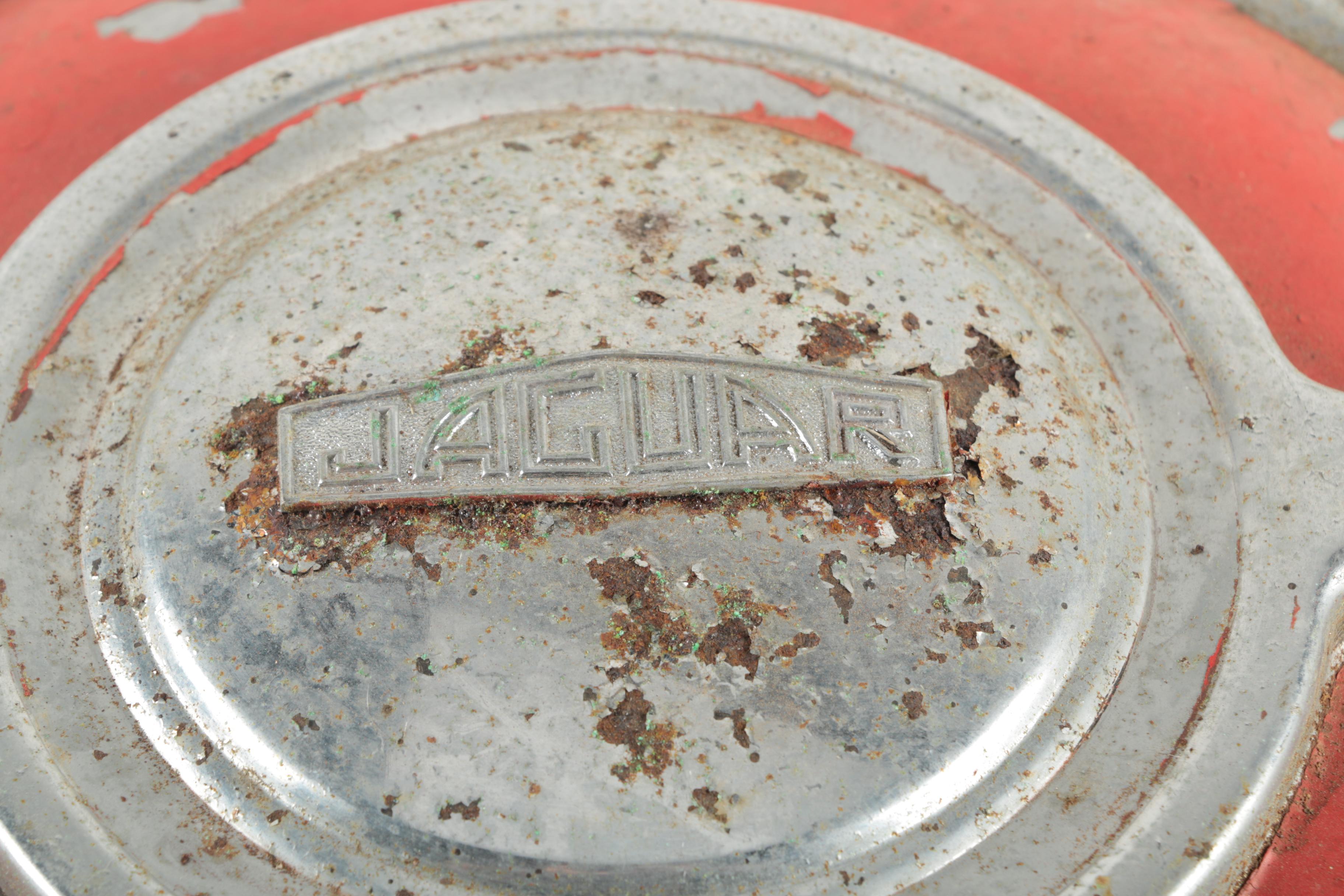 Two Red Vintage Jaguar Hubcaps