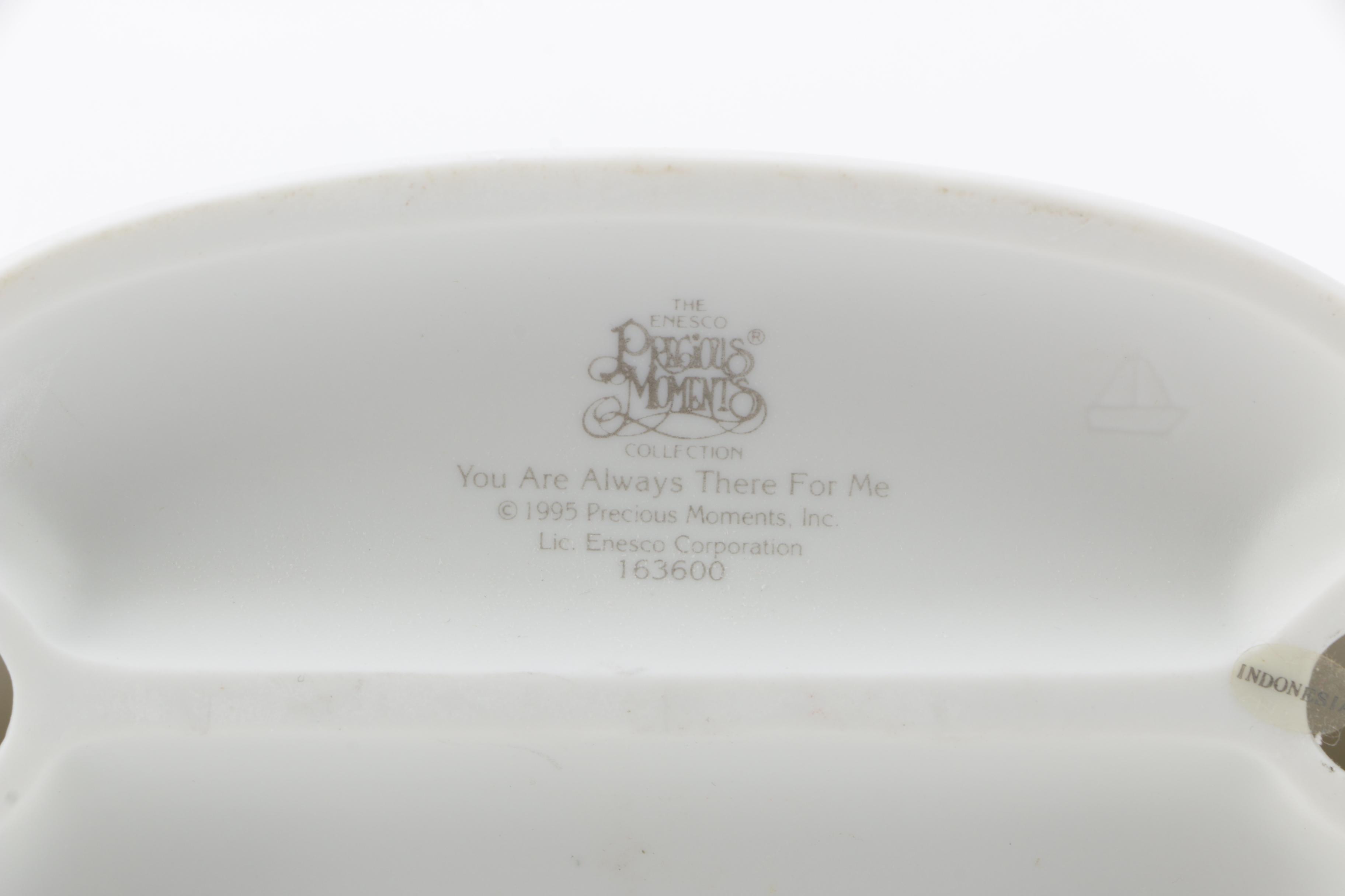 A Collection of Precious Moments Figurines