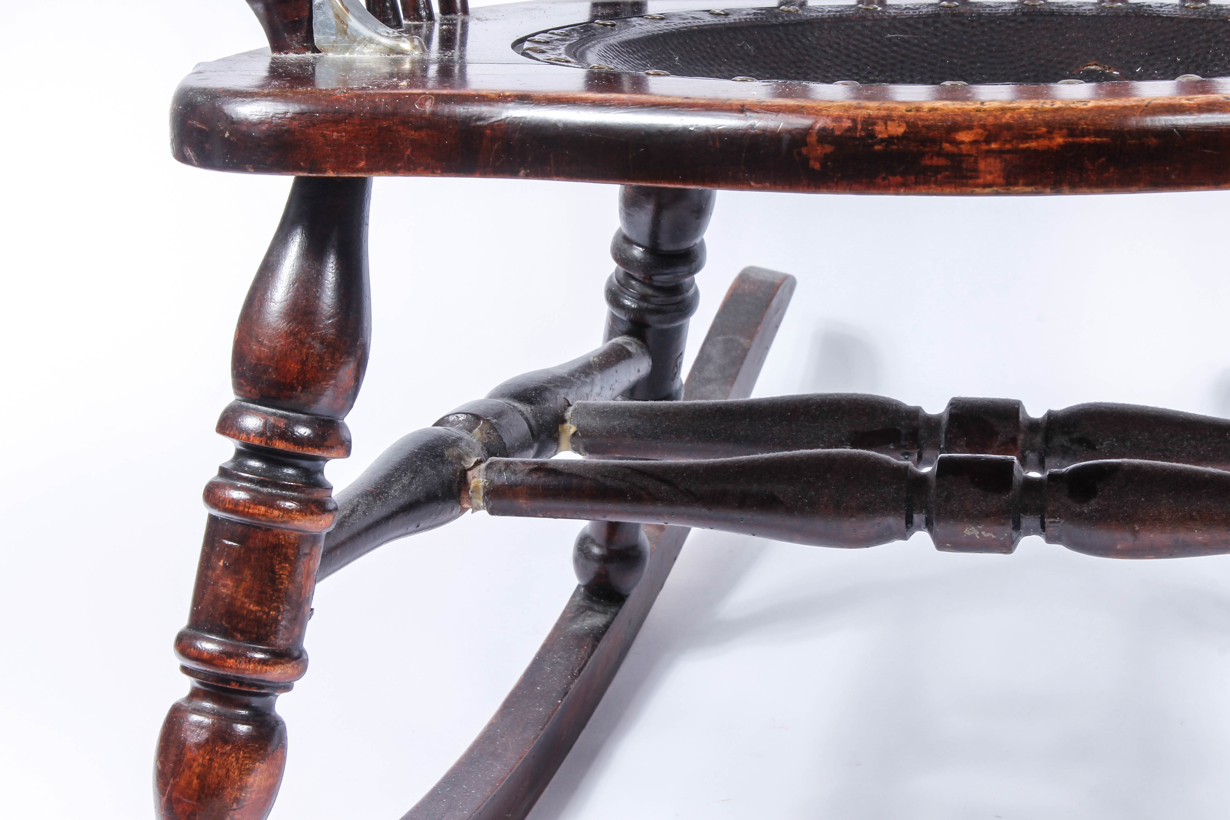 Antique Pressed Back Rocking Chair with Leather Seat