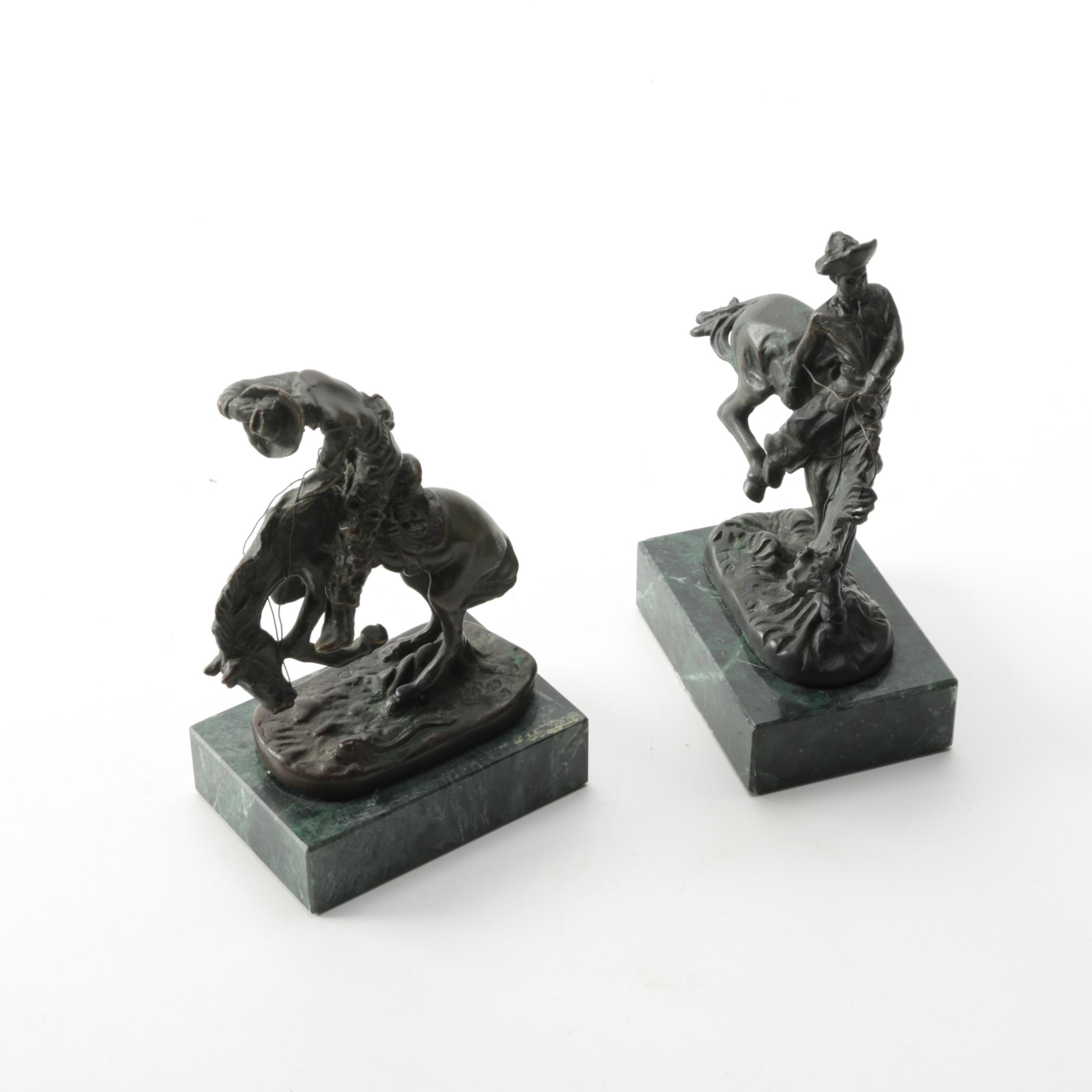 Pair of Frederic Remington Reproduction Metal Western Themed Sculptures