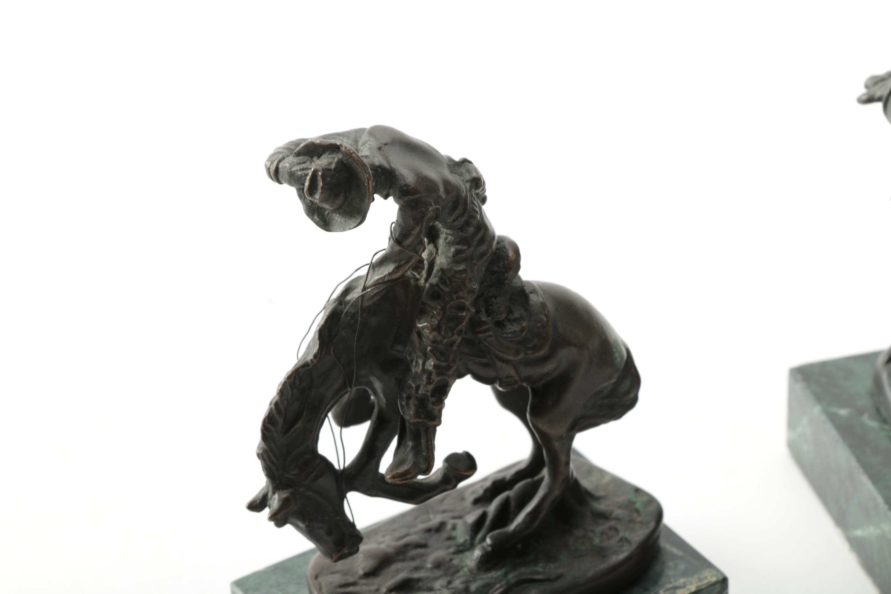 Pair of Frederic Remington Reproduction Metal Western Themed Sculptures