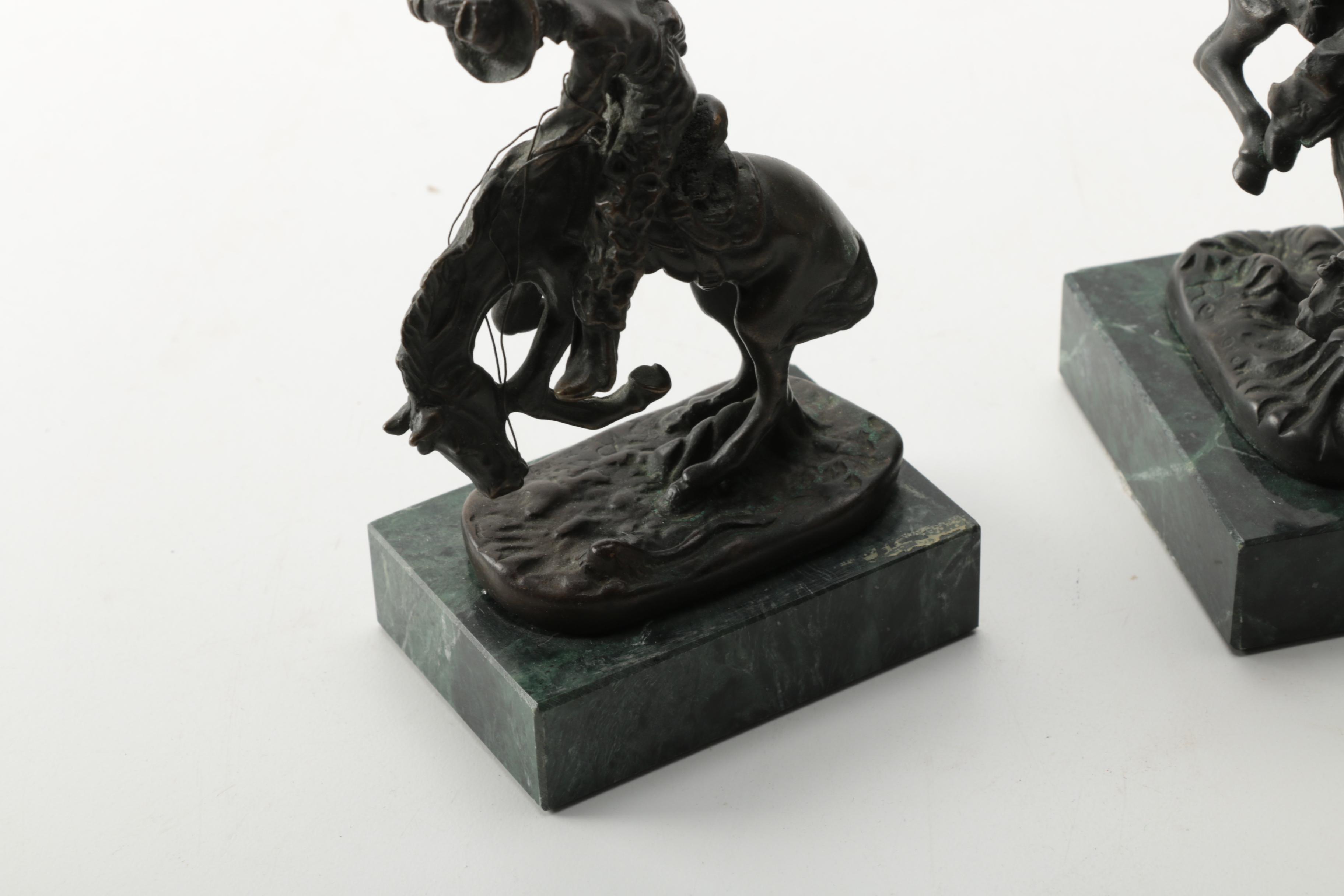 Pair of Frederic Remington Reproduction Metal Western Themed Sculptures