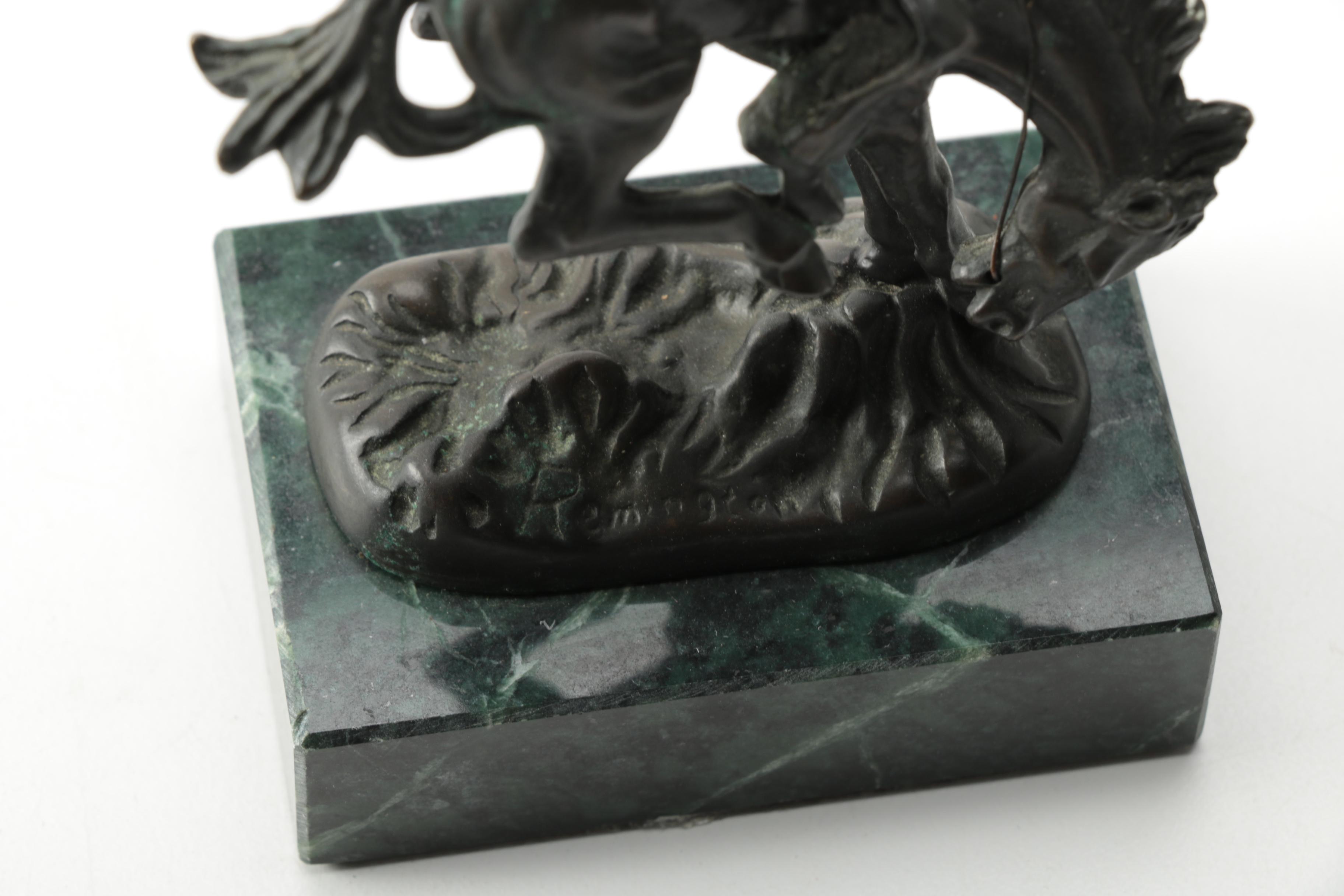 Pair of Frederic Remington Reproduction Metal Western Themed Sculptures