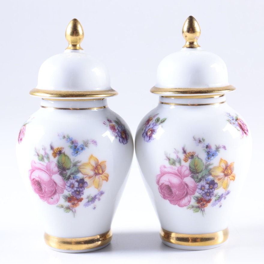 Pair of Lidded Porcelain Urns with Floral Motif