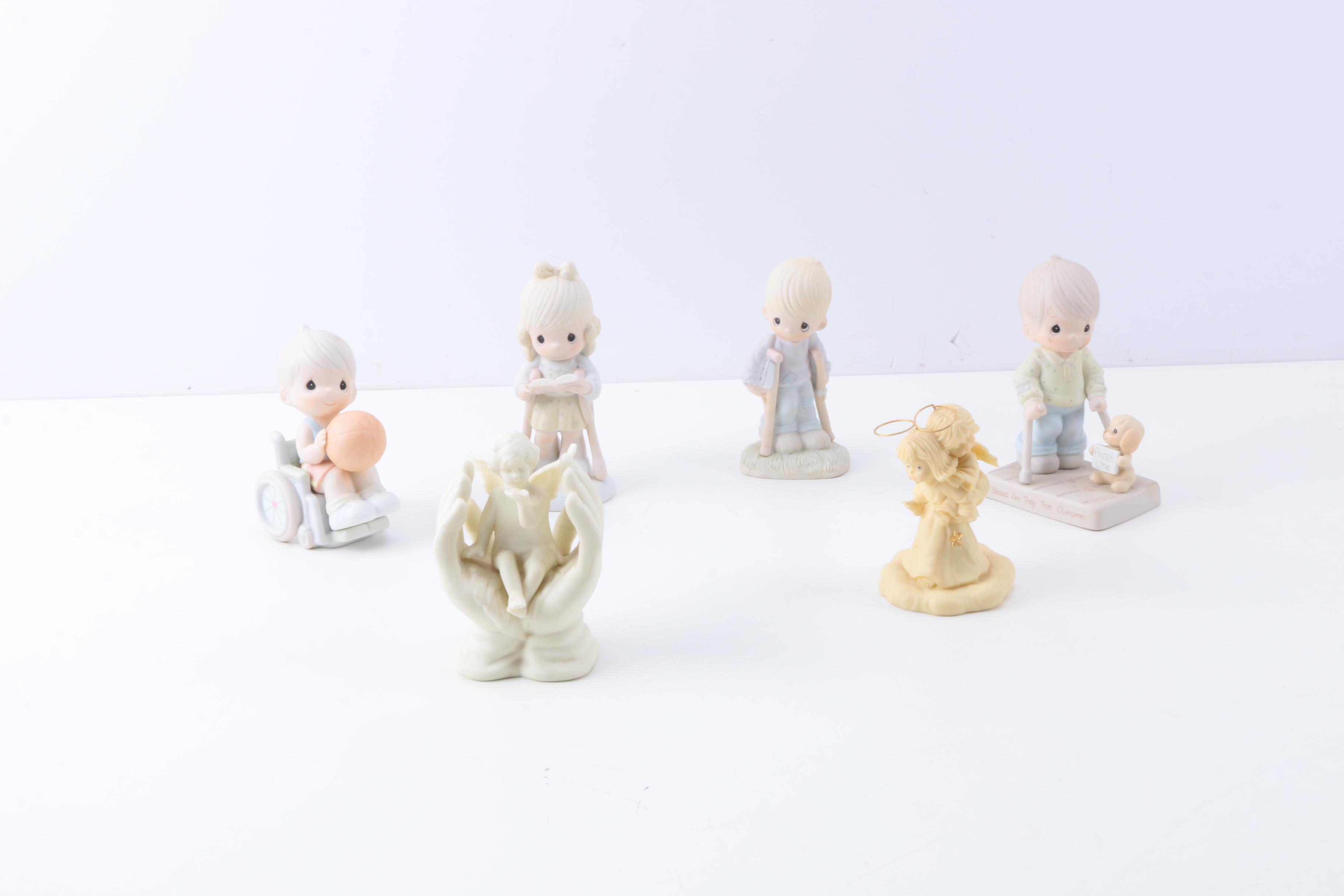 Precious Moments Figurines with "Give Ability A Chance" and Additional Figurines