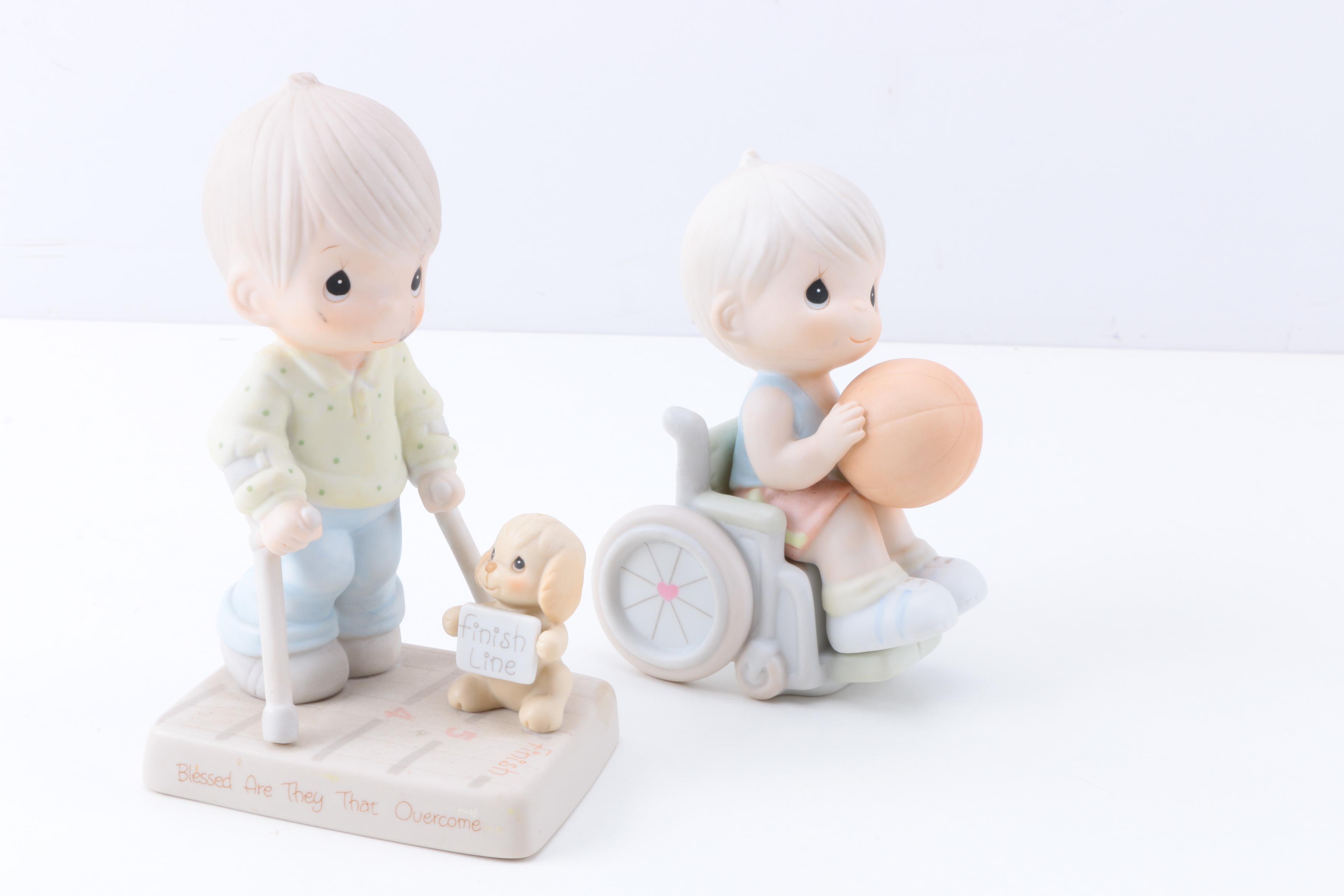 Precious Moments Figurines with "Give Ability A Chance" and Additional Figurines