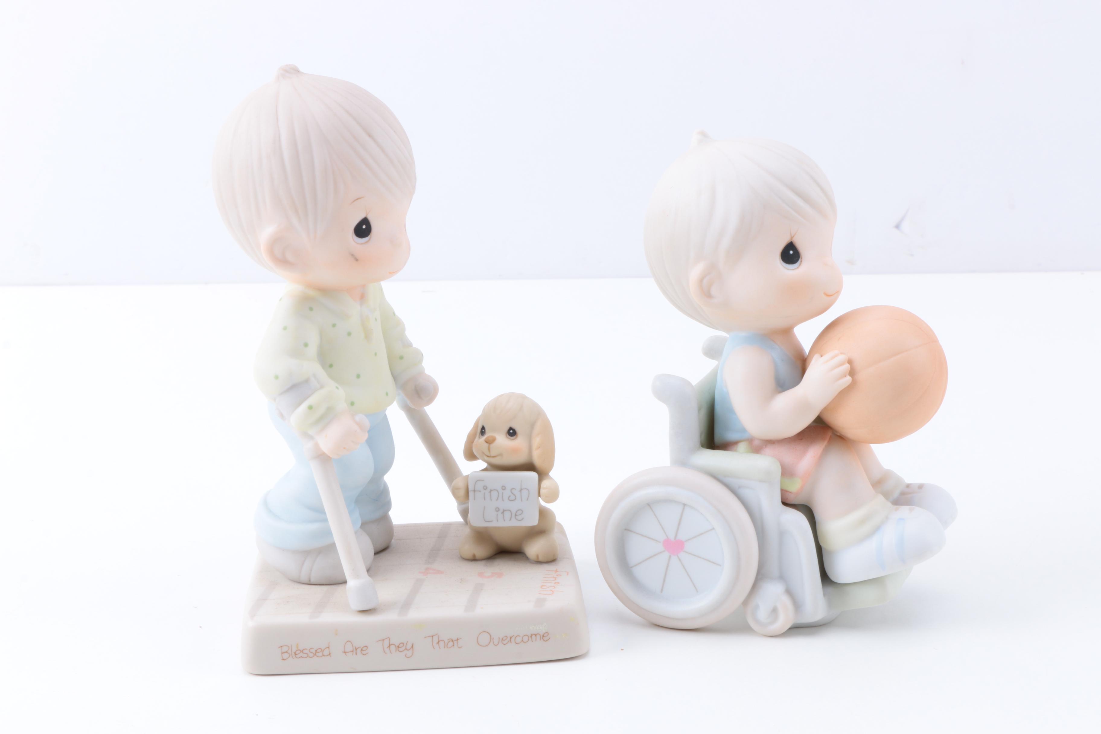 Precious Moments Figurines with "Give Ability A Chance" and Additional Figurines
