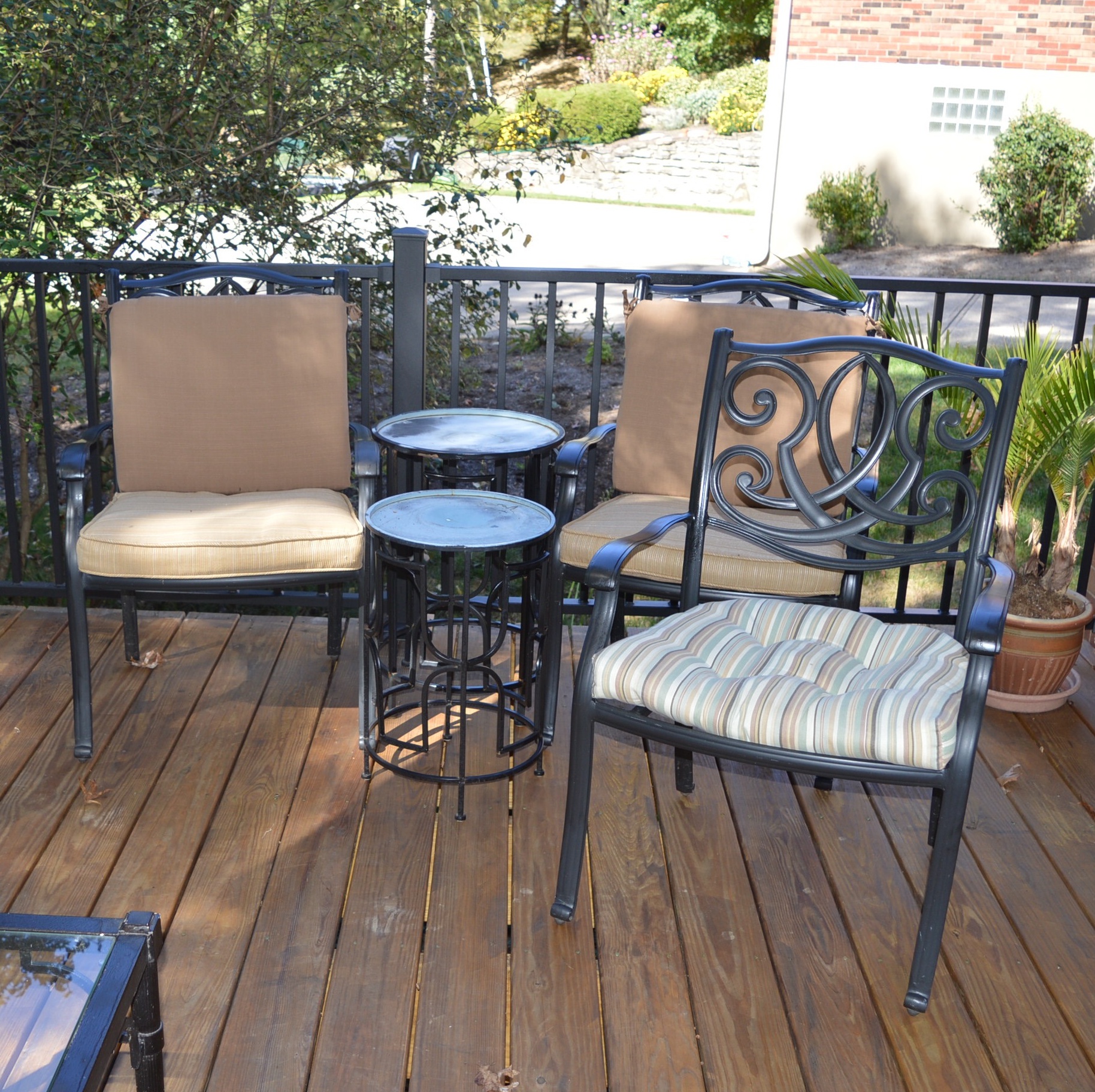 Three Patio Chairs and Two Tables