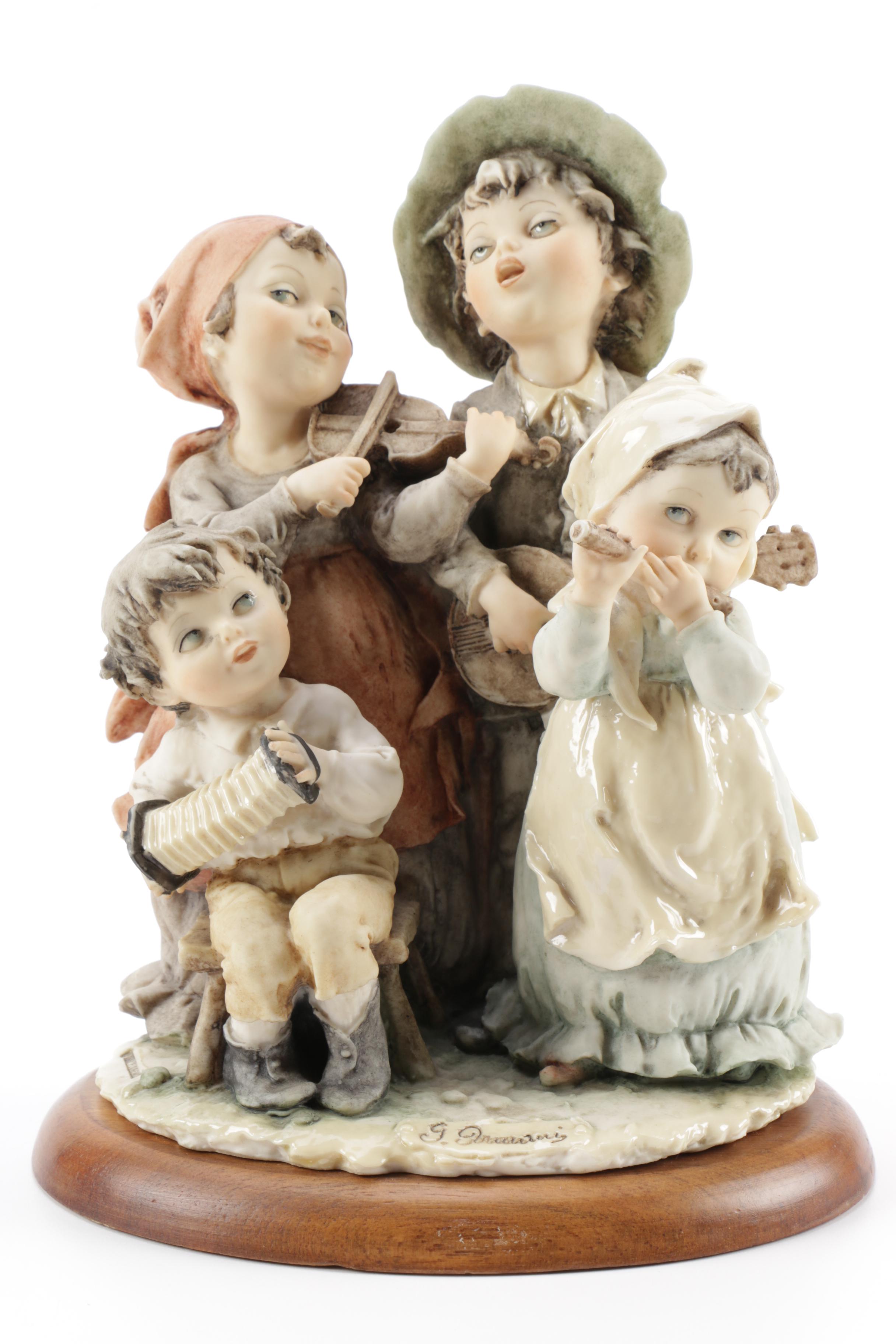 Guiseppe Armani Porcelain Figurine and Hummel "Grandma's Boy"