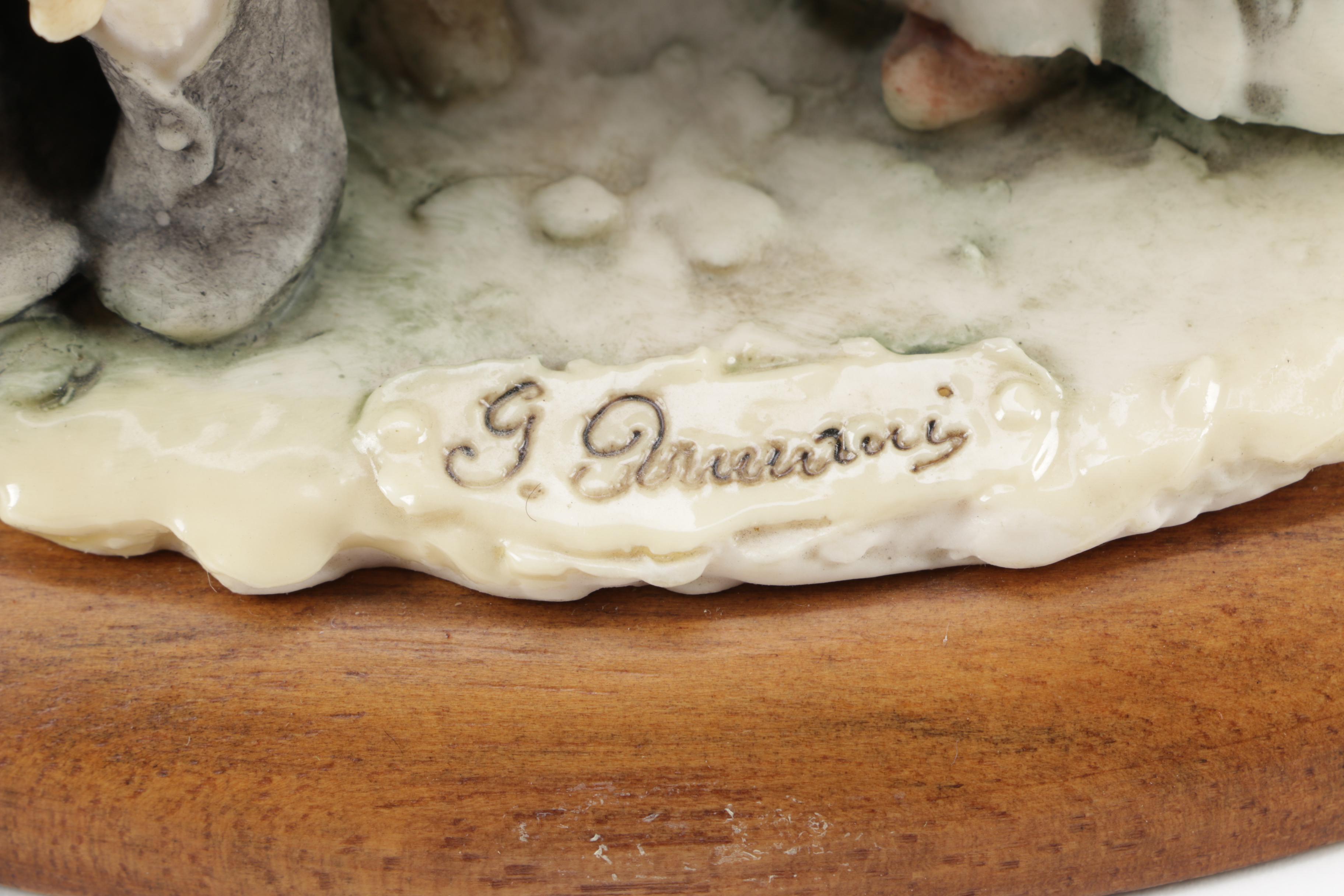 Guiseppe Armani Porcelain Figurine and Hummel "Grandma's Boy"