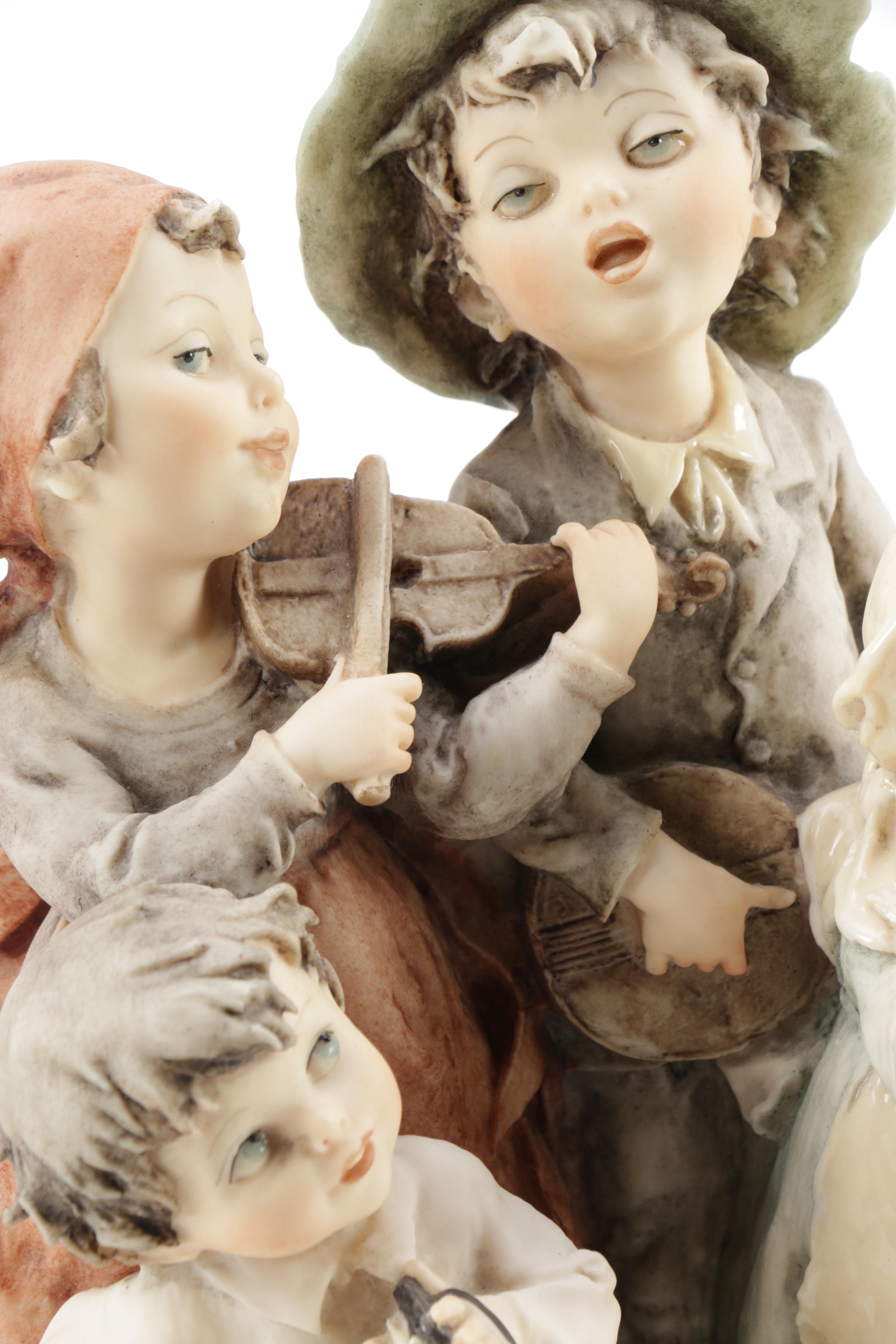 Guiseppe Armani Porcelain Figurine and Hummel "Grandma's Boy"