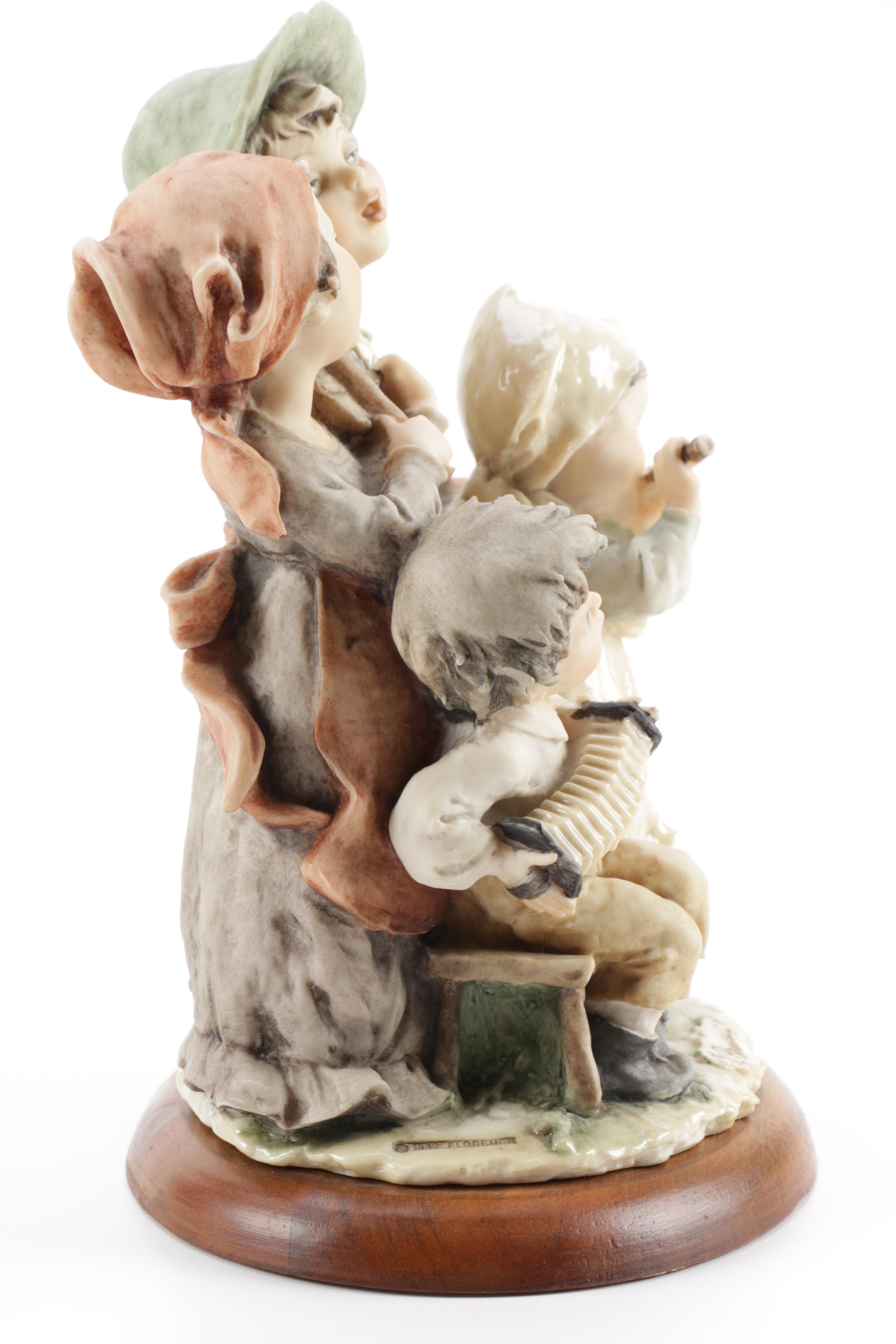 Guiseppe Armani Porcelain Figurine and Hummel "Grandma's Boy"