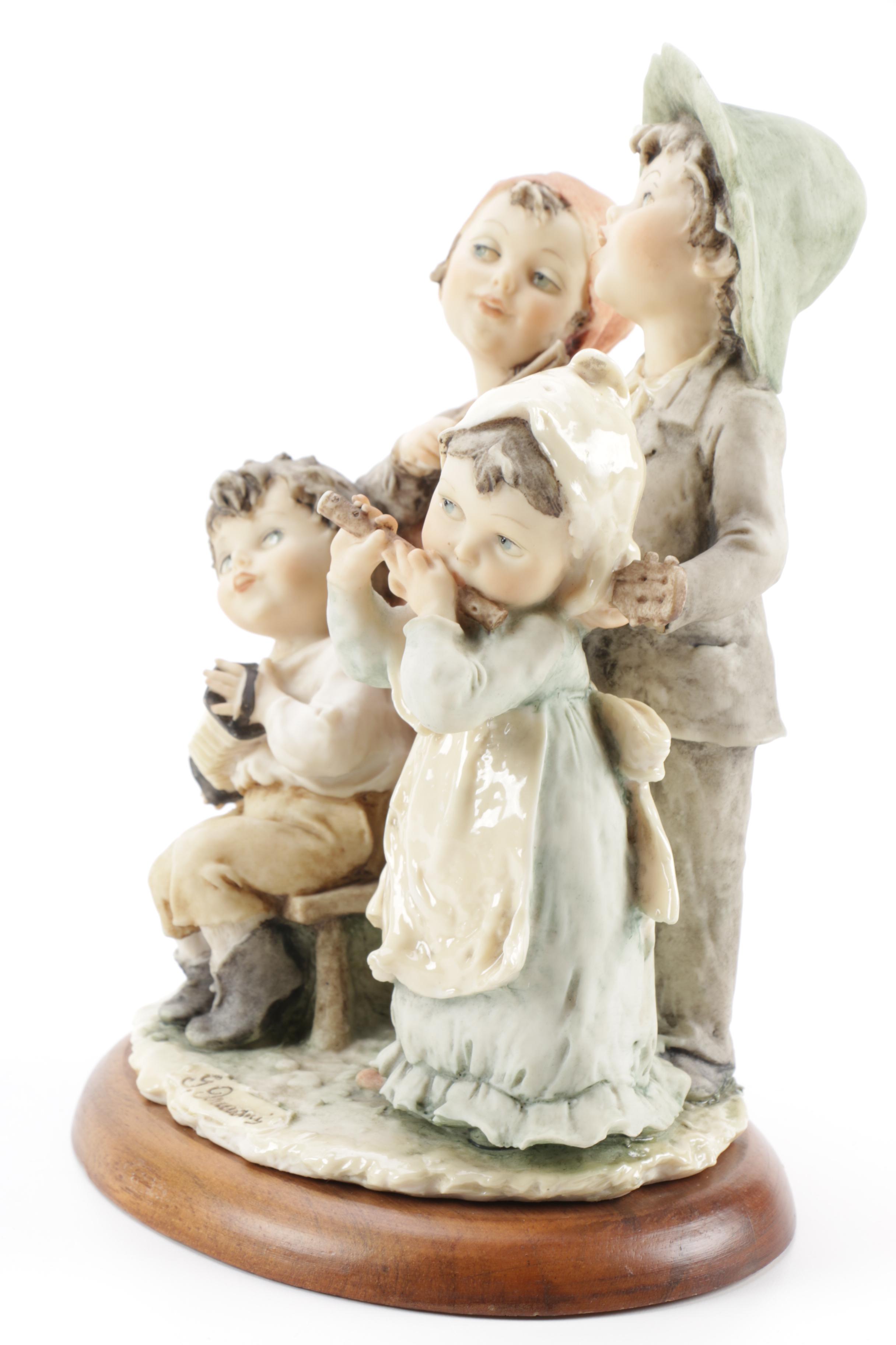 Guiseppe Armani Porcelain Figurine and Hummel "Grandma's Boy"