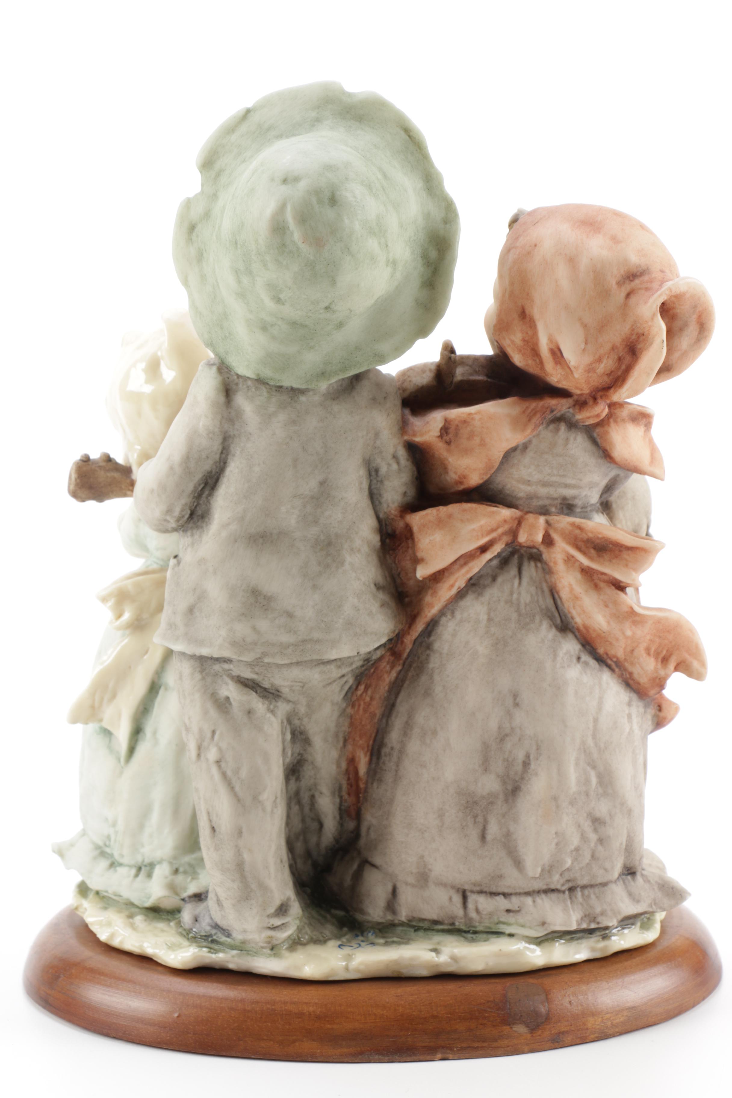 Guiseppe Armani Porcelain Figurine and Hummel "Grandma's Boy"