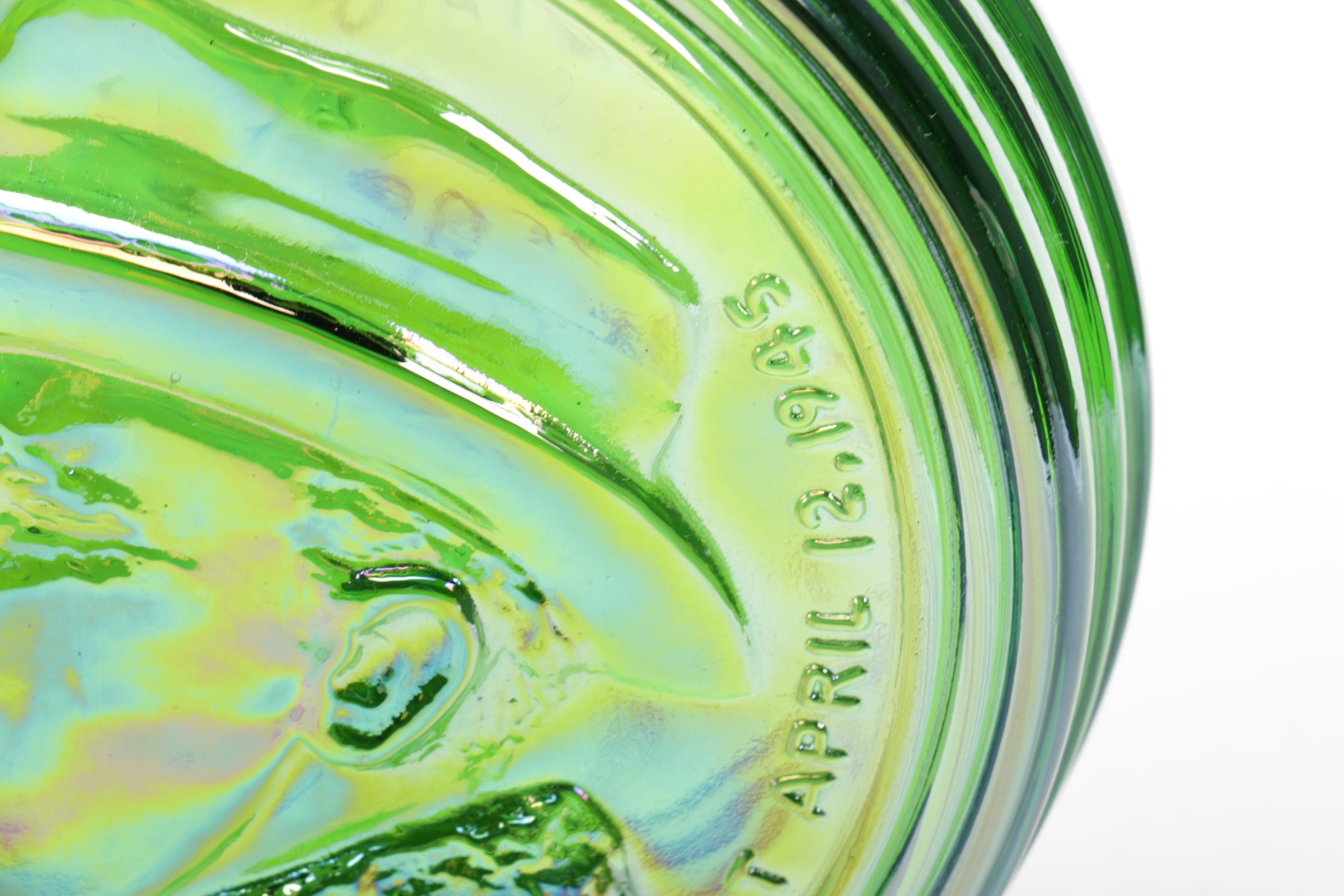Iridescent Green Glass Bottle with Roosevelt Motif