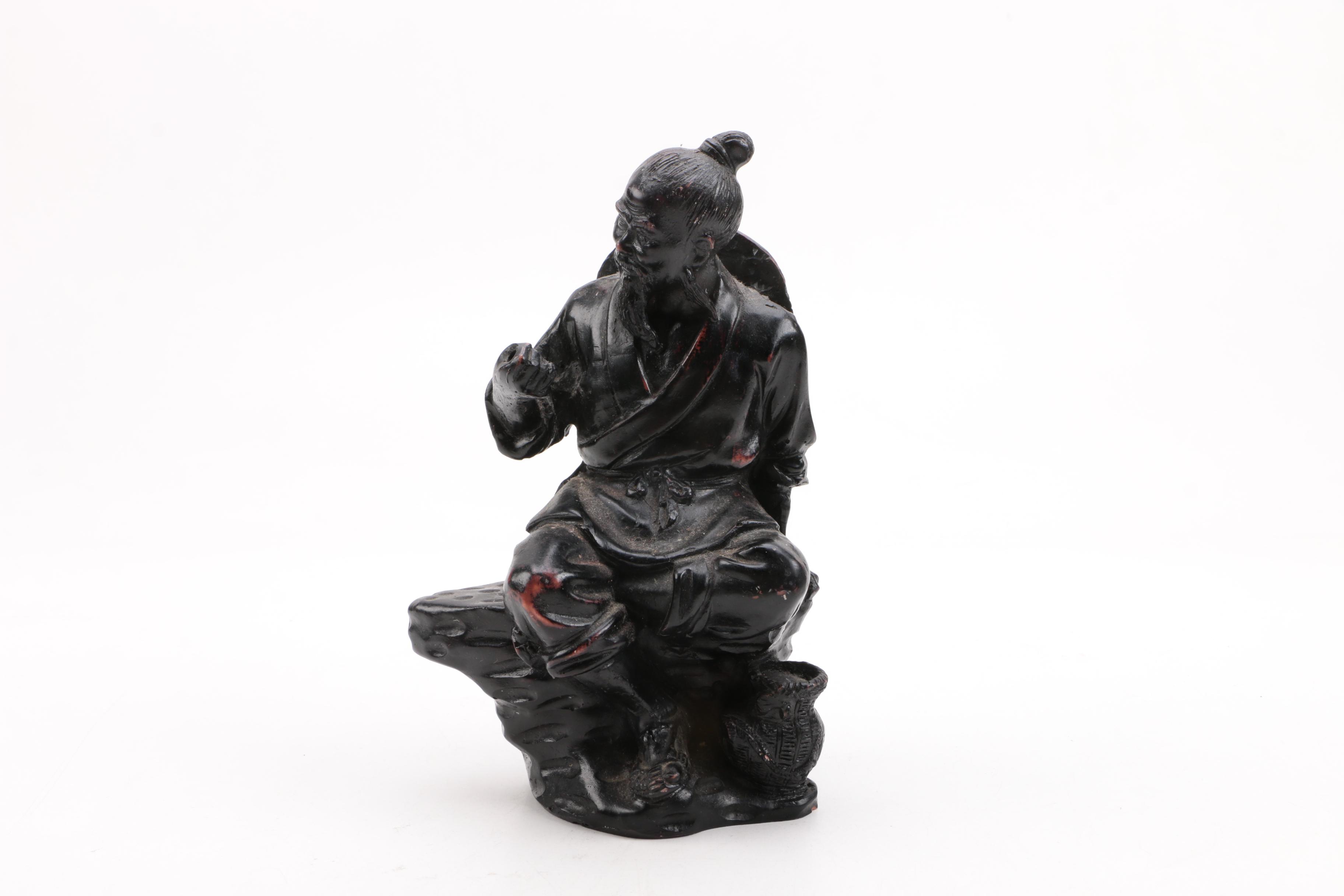 Cast Resin Statuette of a Seated Figure