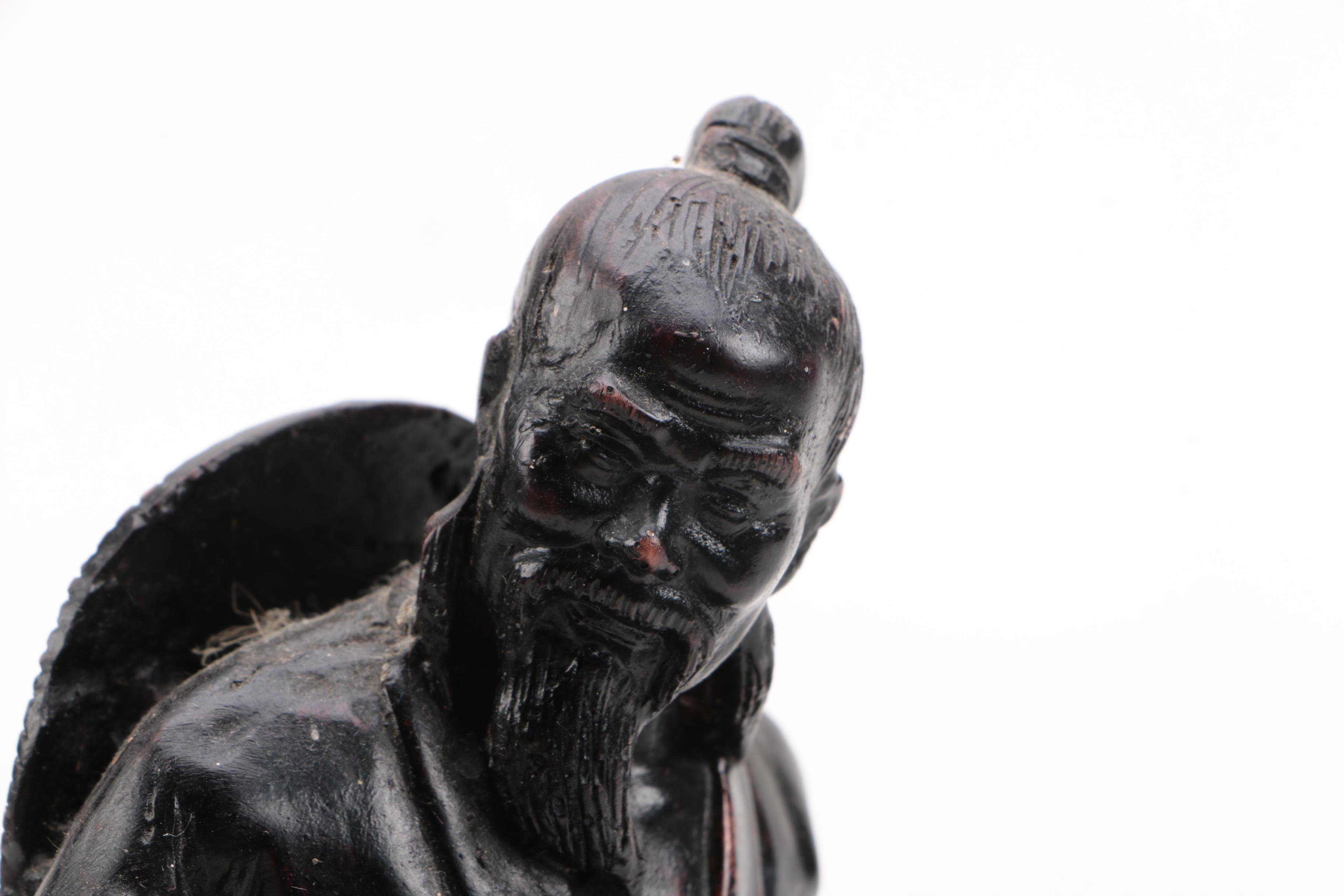 Cast Resin Statuette of a Seated Figure