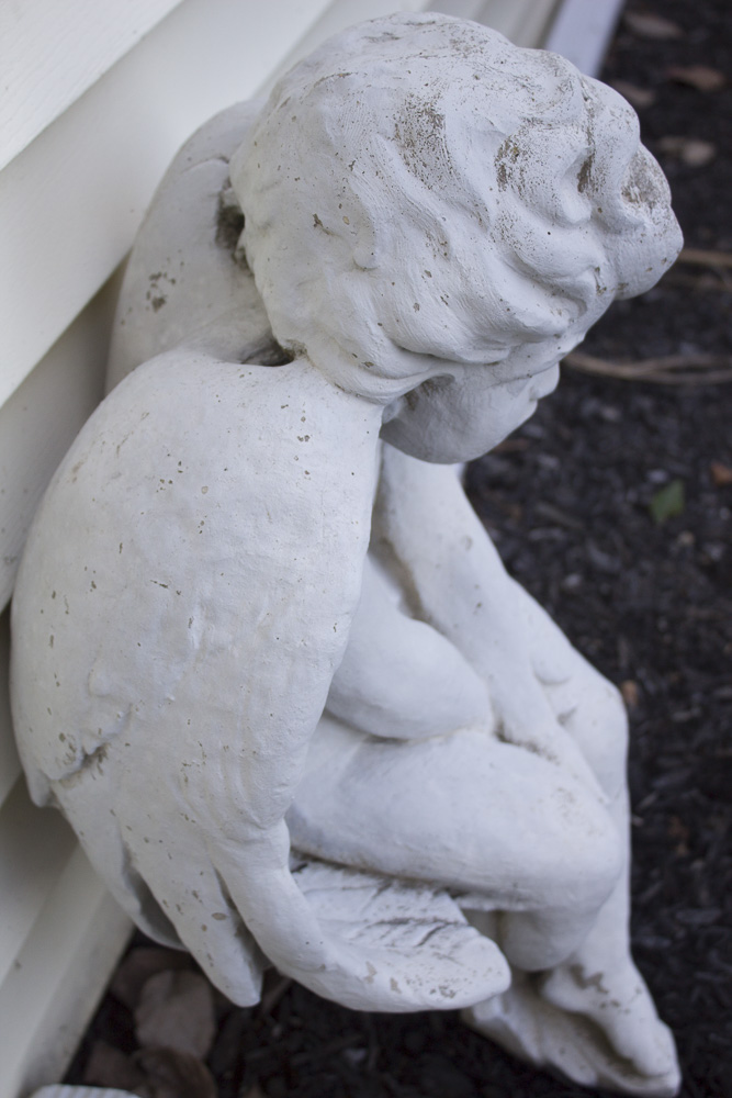 Seated Cherub Statue