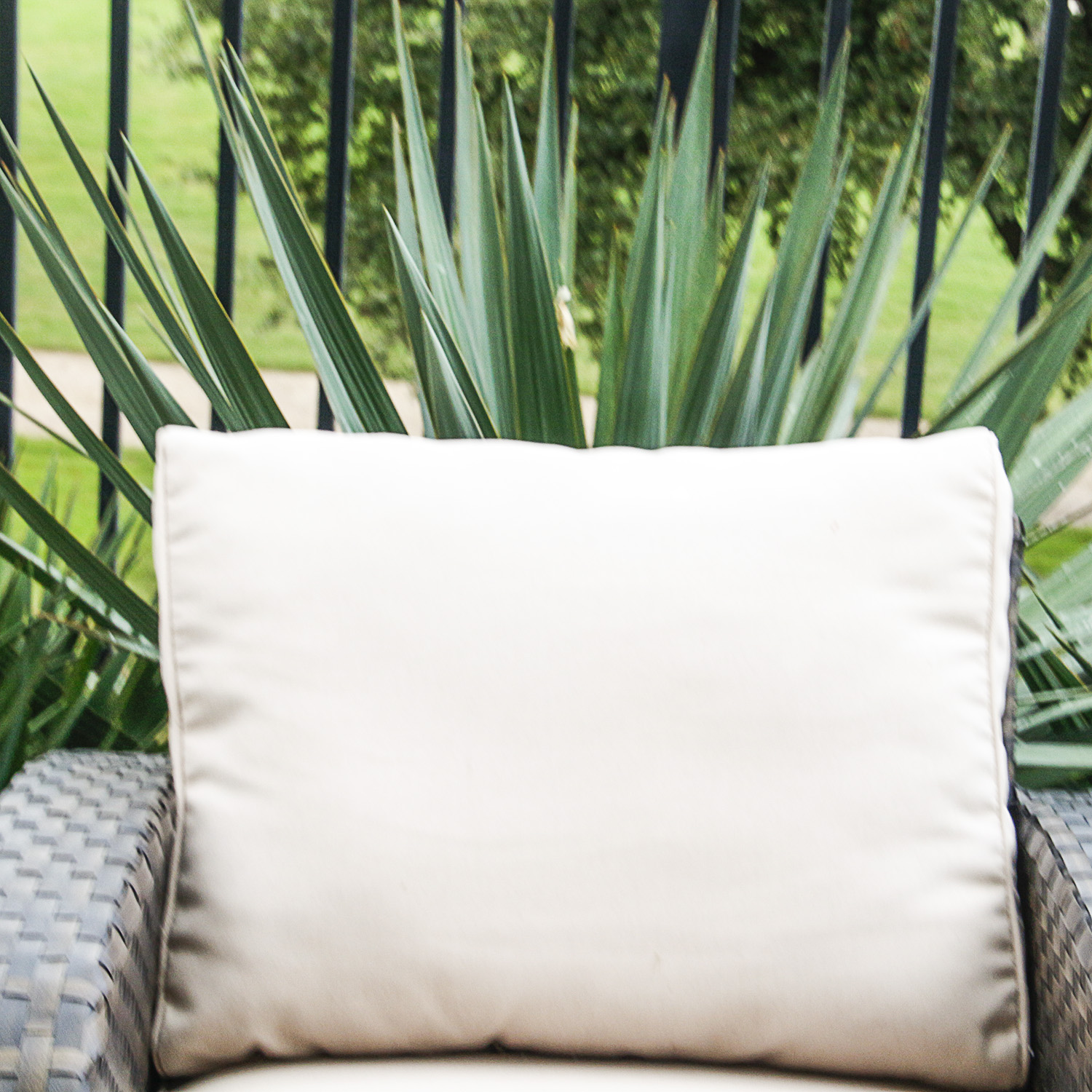 Brown Woven Patio Chair with Cream Upholstered Cushions