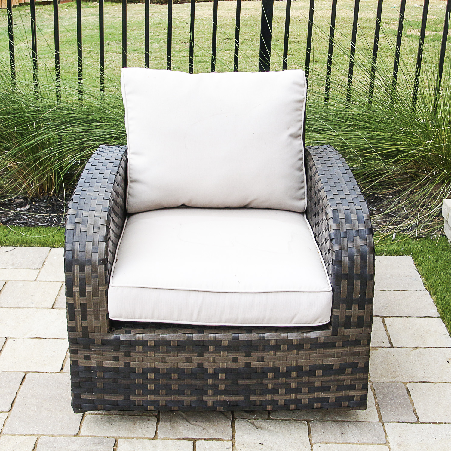 Brown Faux Wicker Patio Armchair with Cream Hued Cushions