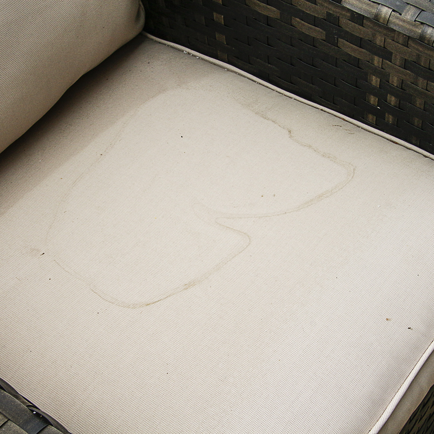 Brown Faux Wicker Patio Armchair with Cream Hued Cushions