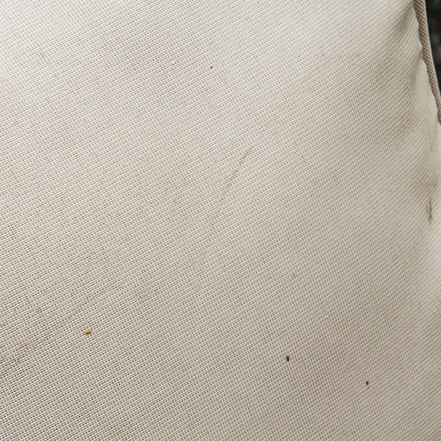 Brown Faux Wicker Patio Armchair with Cream Hued Cushions