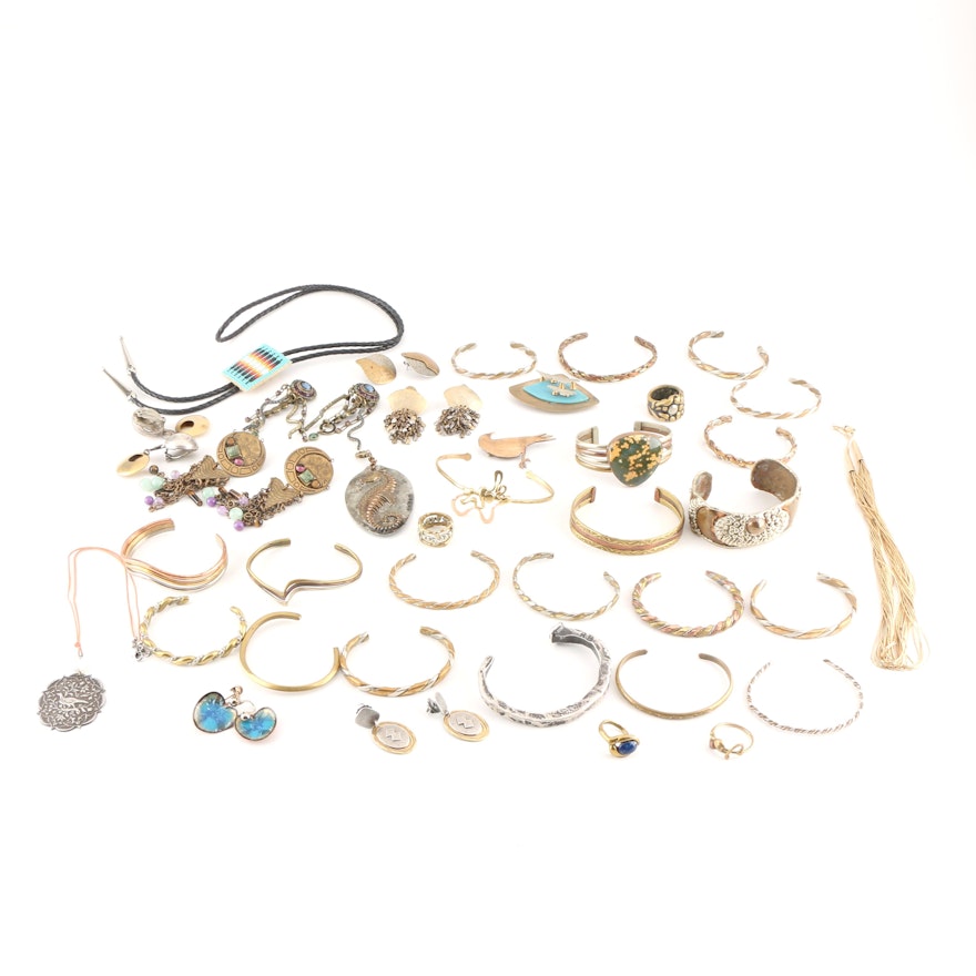 Assortment of Costume Jewelry Including a Sterling Silver Bracelet