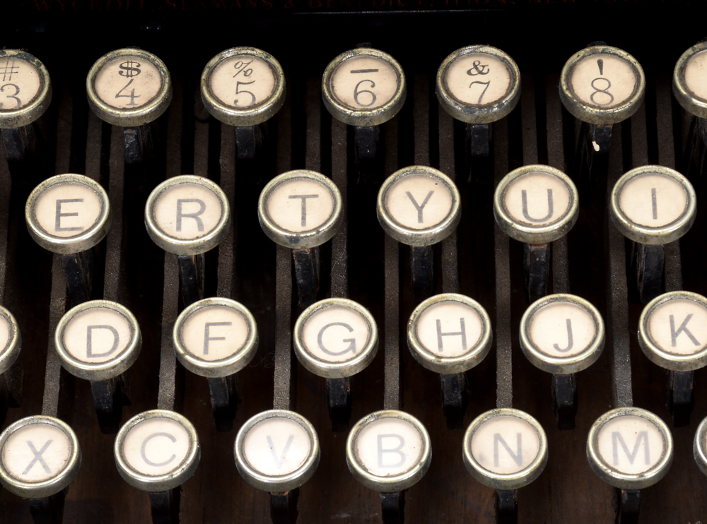 Antique Remington Typewriter and Metal Cover