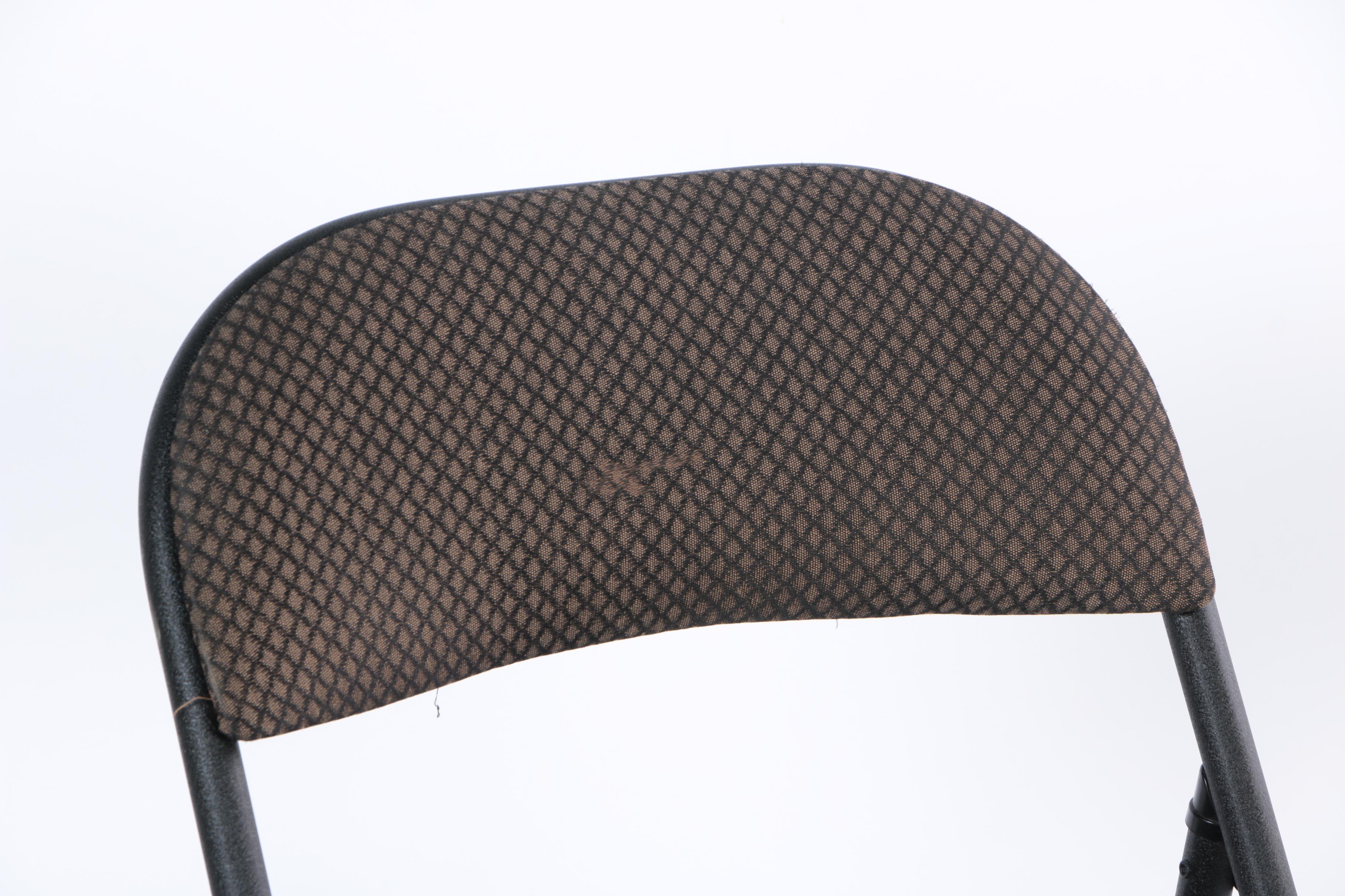 Four Padded Folding Chairs by Cosco